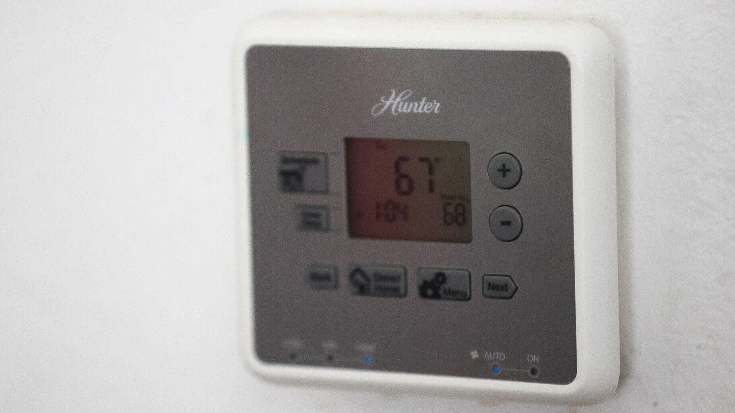 Image of home thermostat. What will our power bills look like after running our air conditioning un...