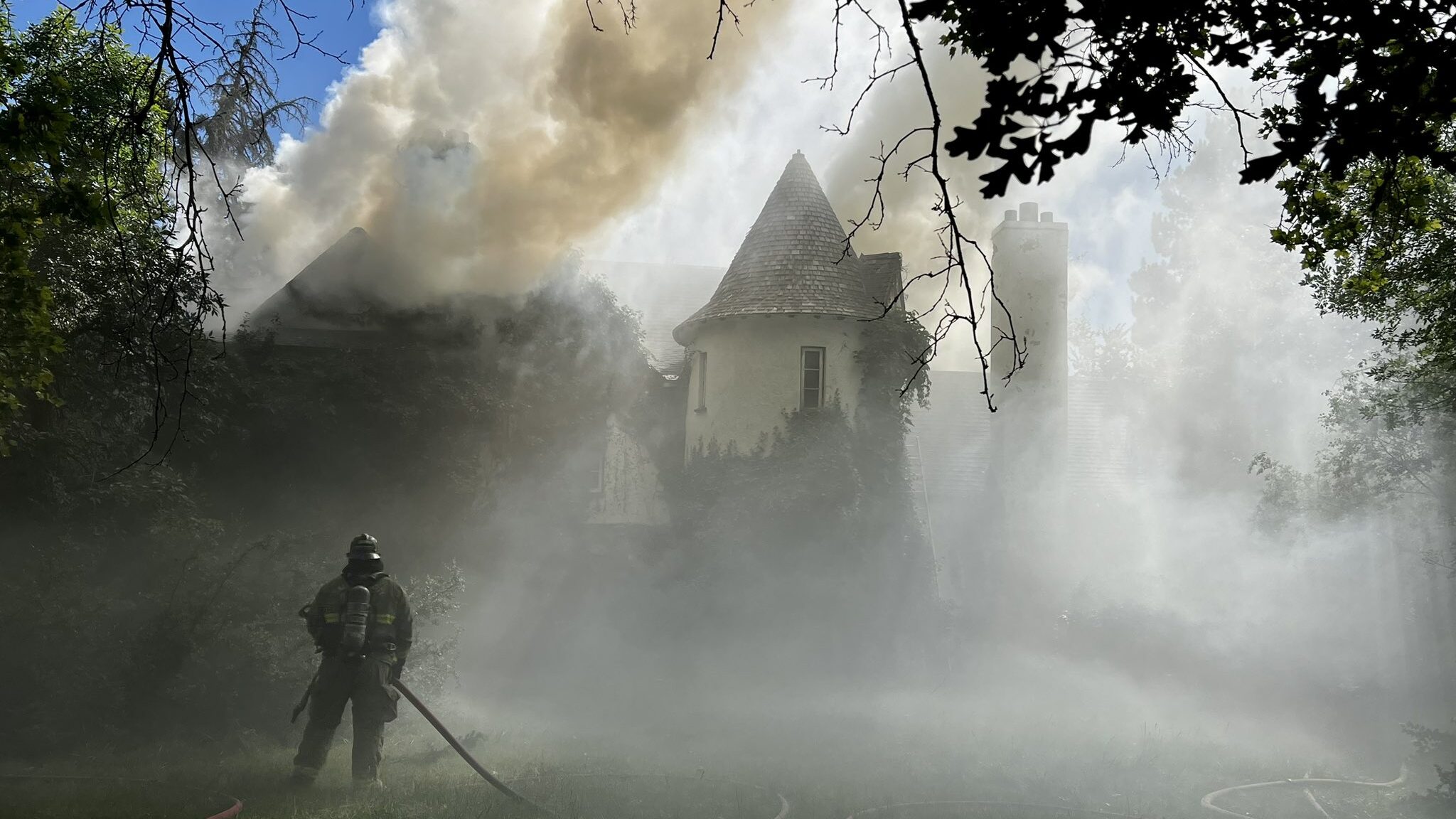 Image of thick smoke from a house fire in Holladay, Utah. The fire began a little before 3 p.m. on ...