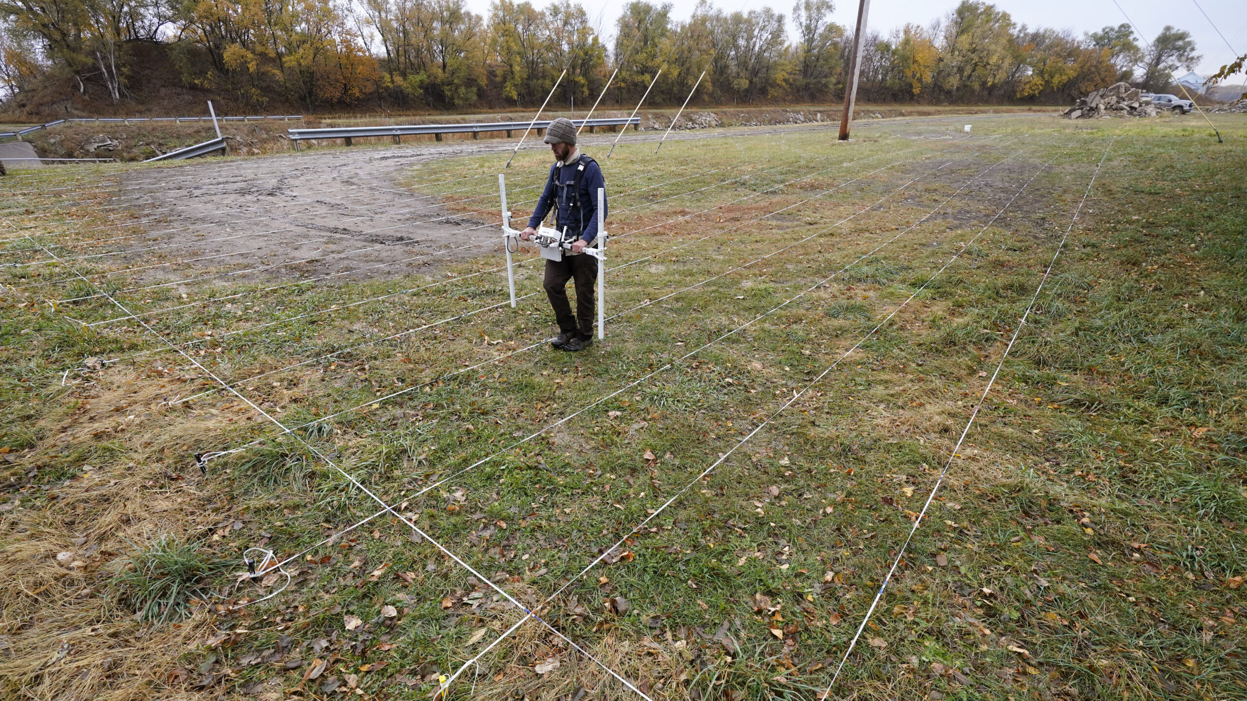Image of a worker using ground penetrating radar in the search for more than 80 Native American chi...