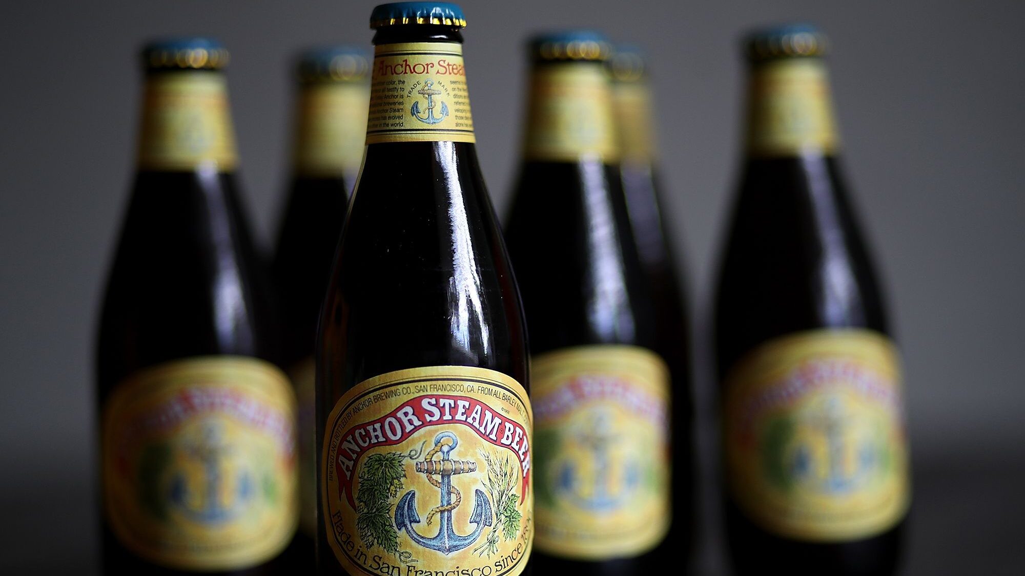 Bottles of Anchor Steam beer are displayed on August 3, 2017 in San Anselmo, California. Photo cred...
