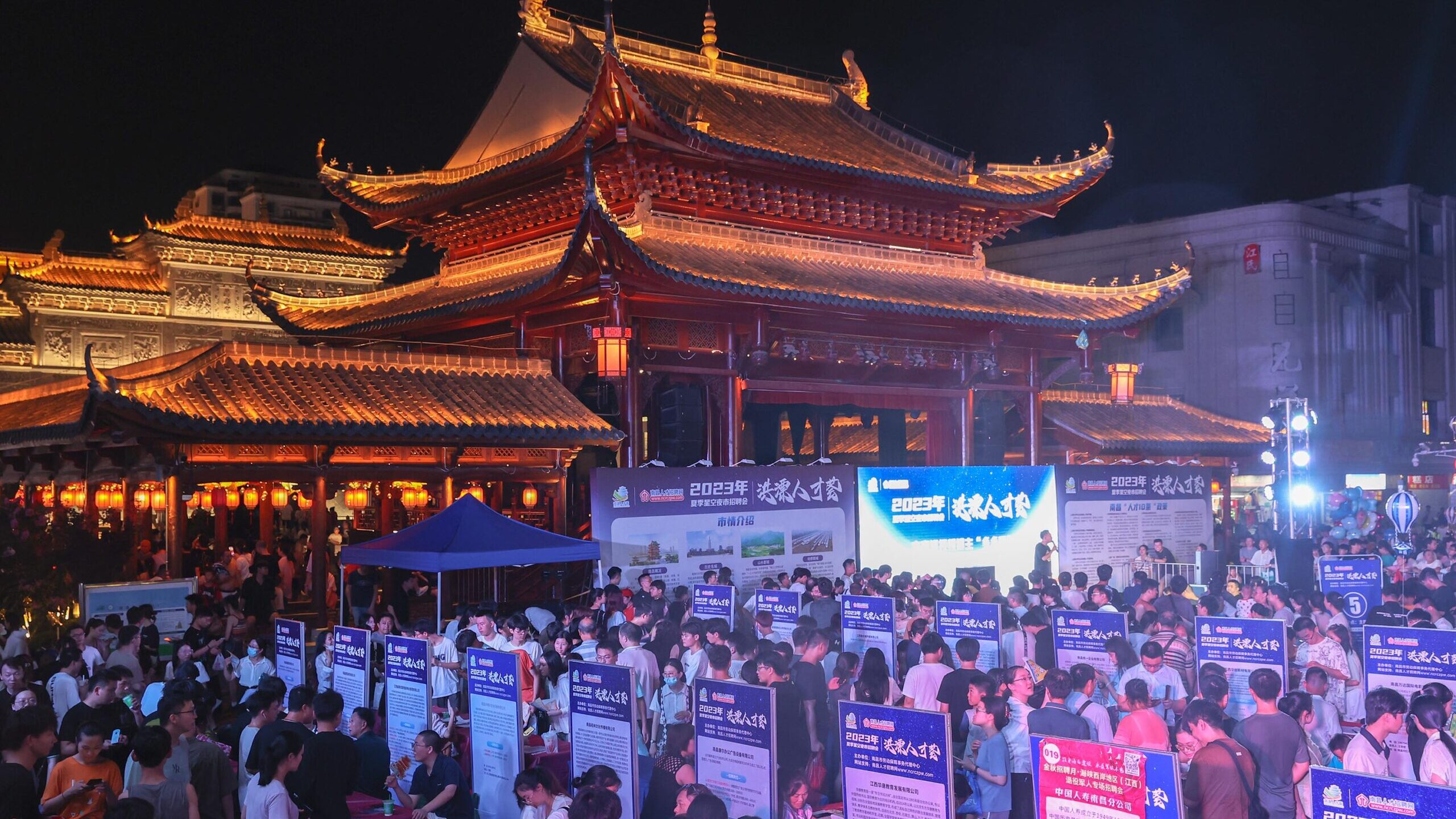 An evening job fair at the Wanshou Palace Historical Culture Block 2023 in southeast China's Jiangx...