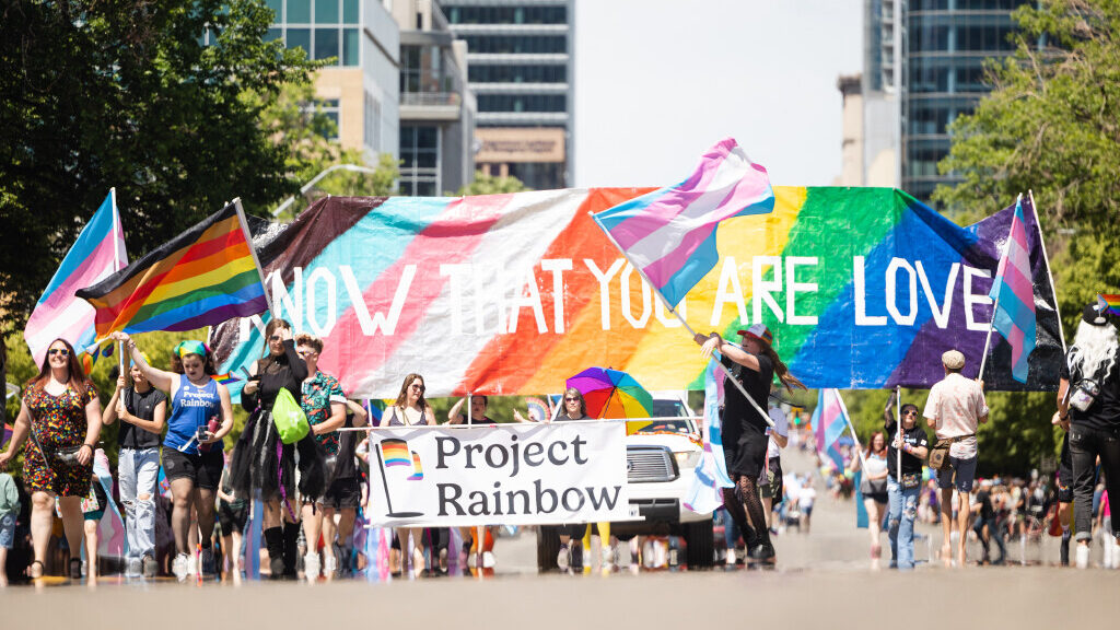 Participants walk during the 2023 Utah Pride Parade in downtown Salt Lake City on June 4, 2023....