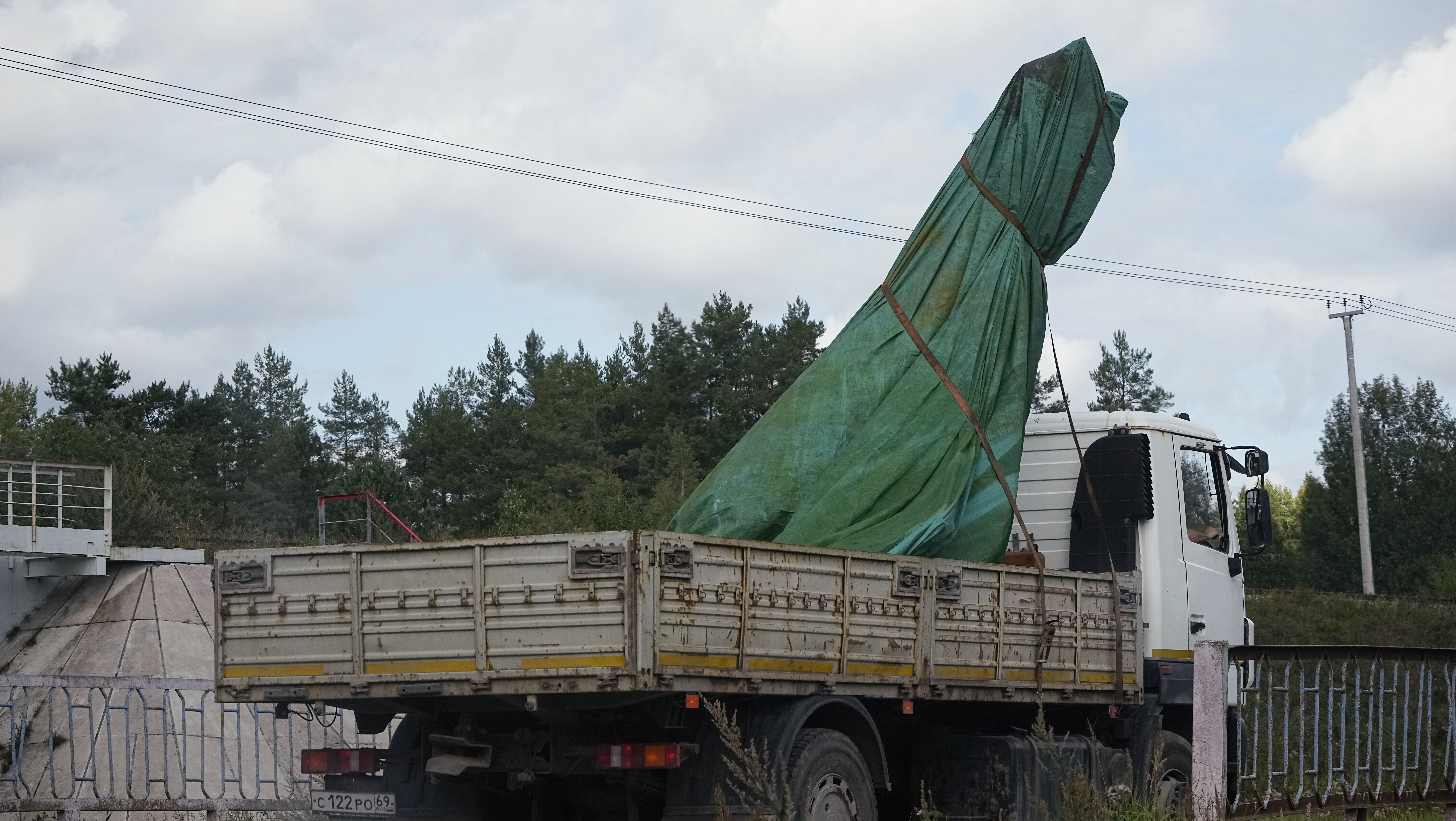 Image of a truck carrying part of a private jet that crashed near the village of Kuzhenkino, Tver r...