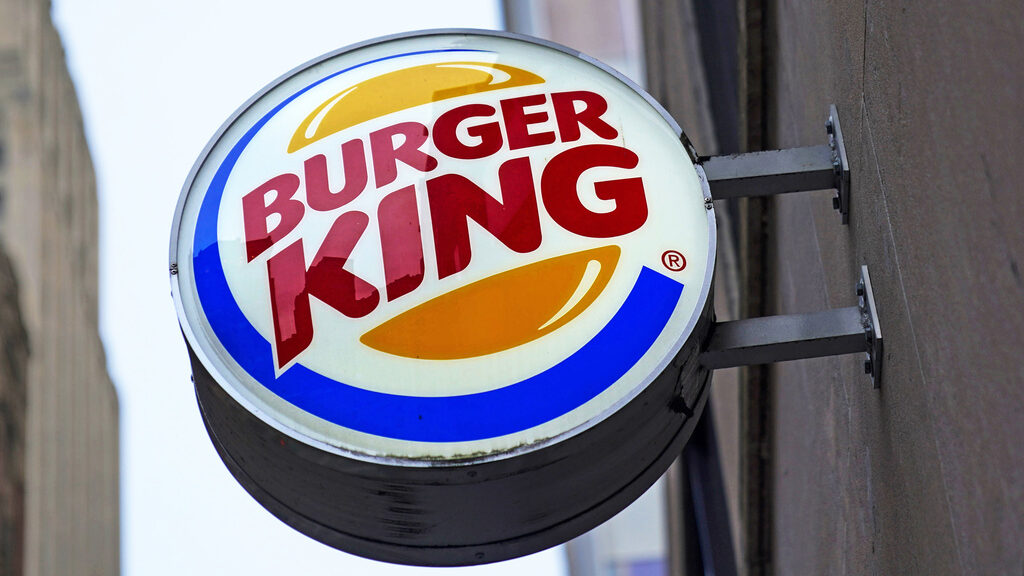 FILE - The Burger King logo is displayed on a sign outside a restaurant in downtown Pittsburgh, Jan...