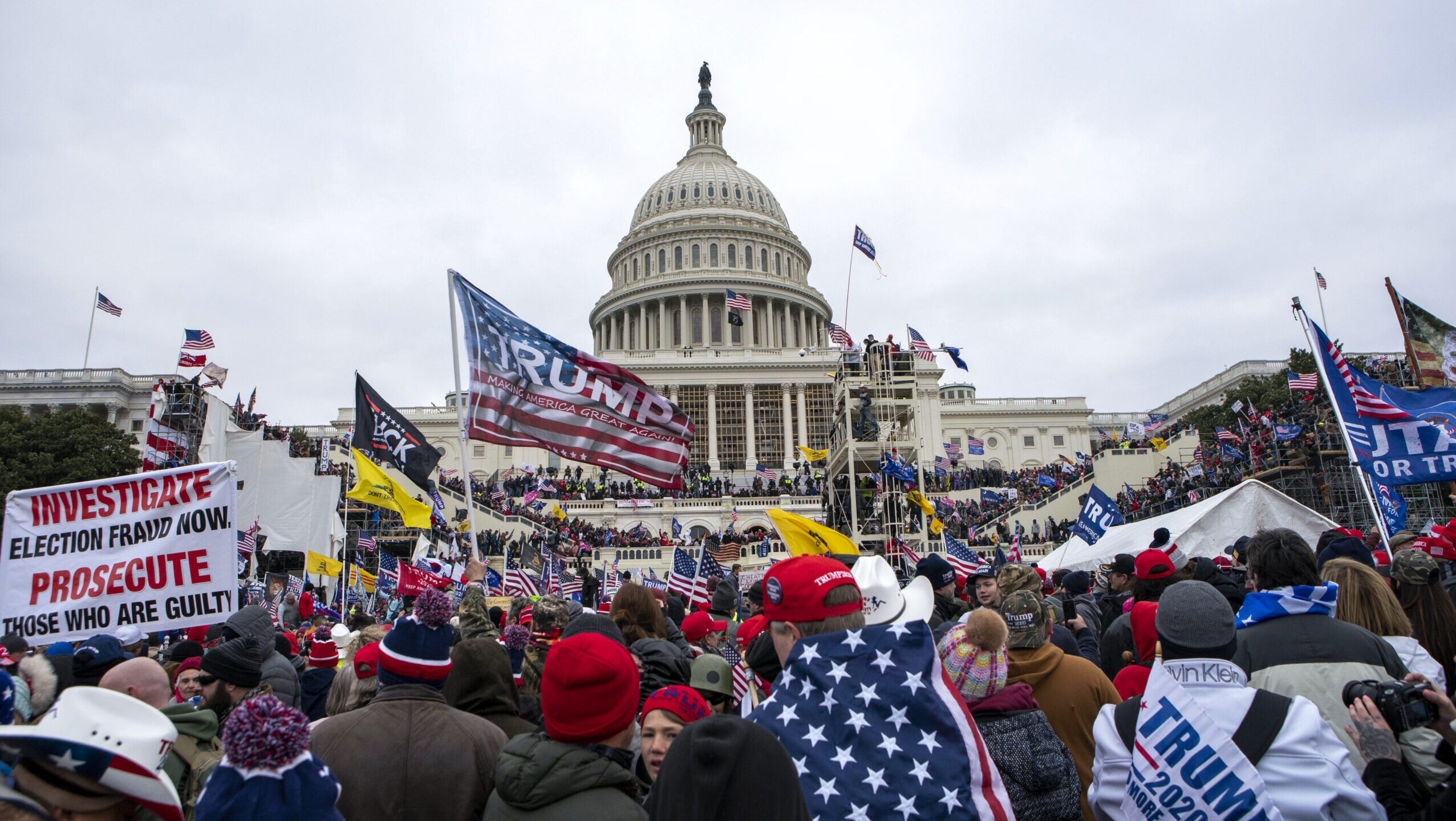 Image shows insurrectionists loyal to President Donald Trump breaching the U.S. Capitol in Washingt...