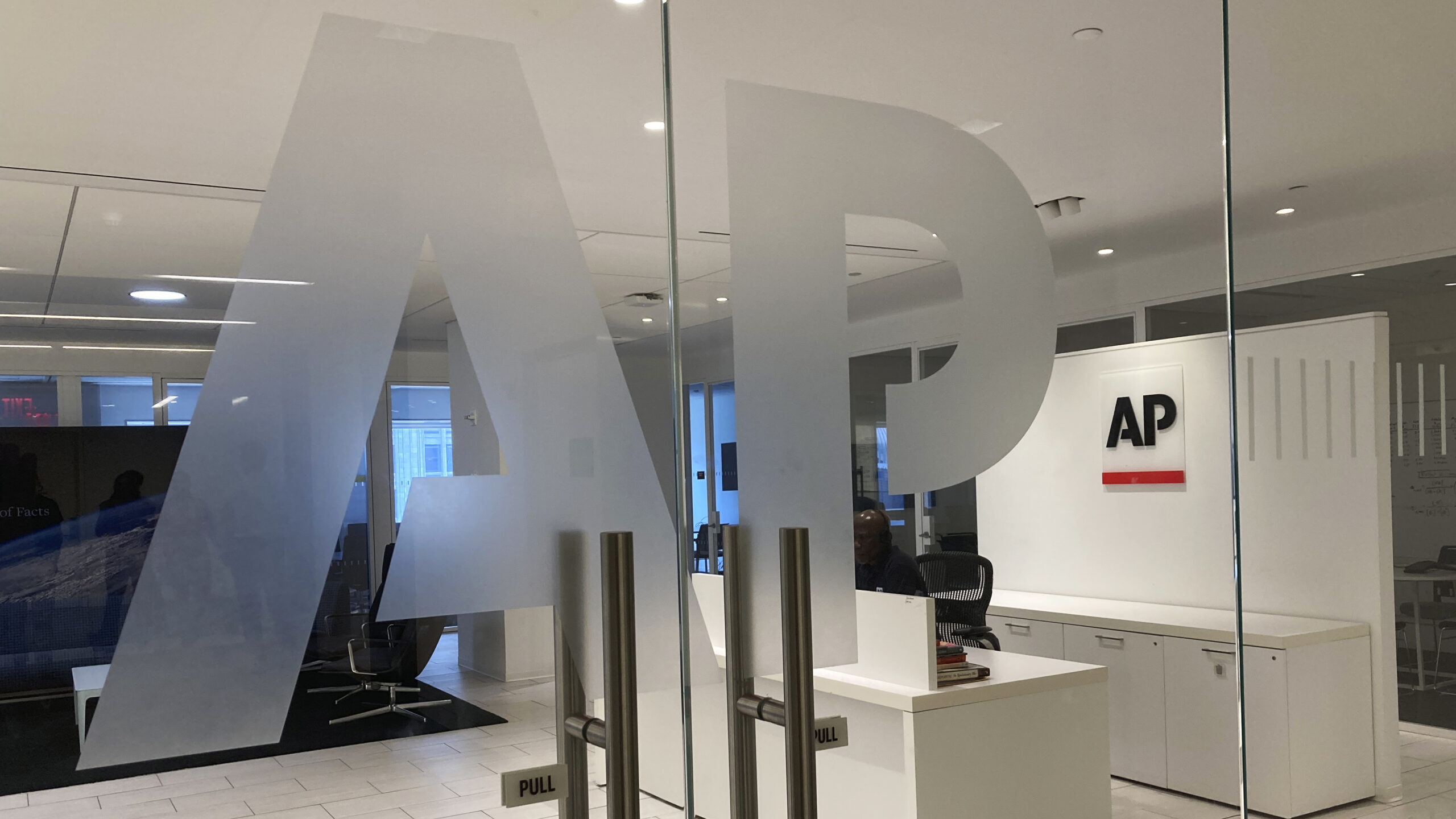 The Associated Press logo is shown at the entrance to the news organization's office in New York. T...