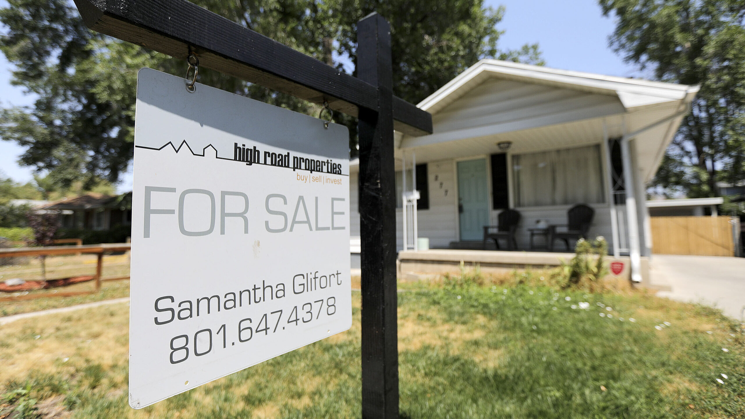 A for sale sign is pictured in front of a home in Salt Lake City. Utah's housing market crisis is j...