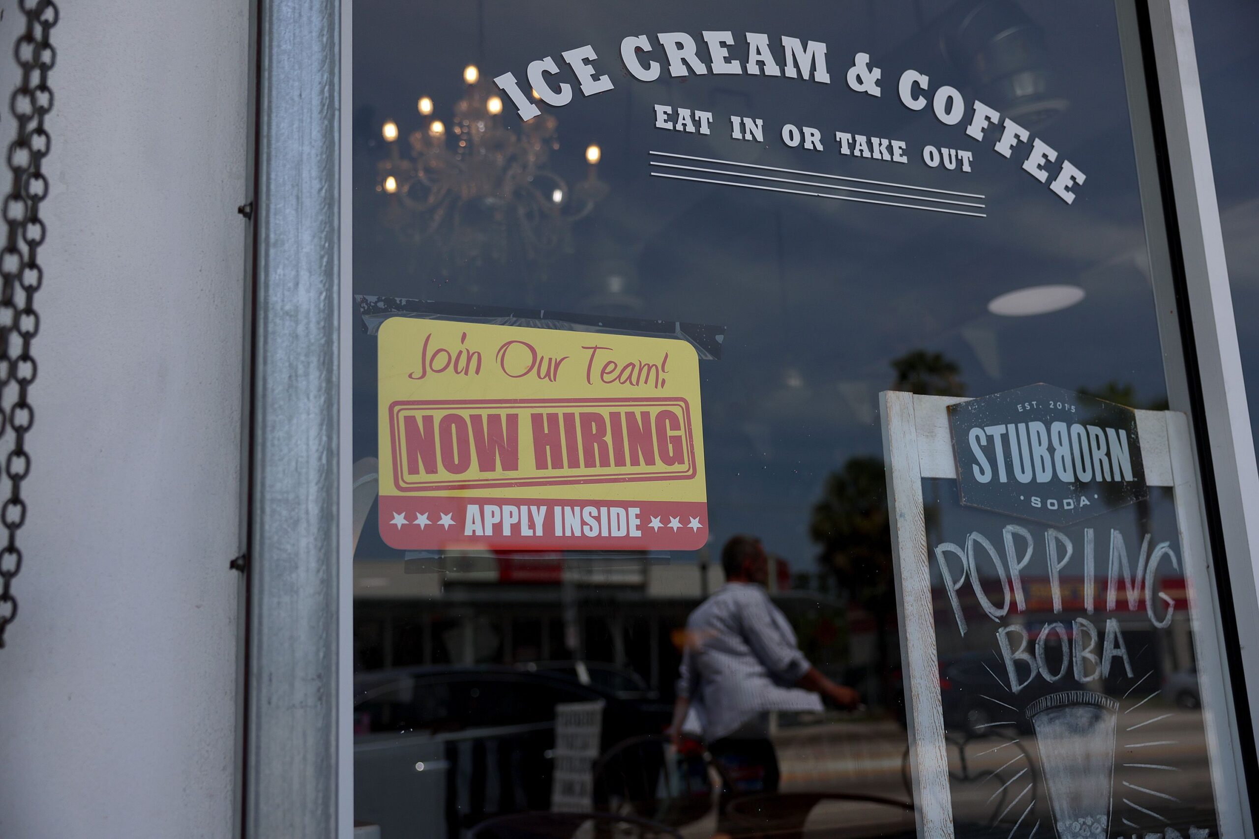 The US labor market is still hot. A 'Now Hiring' sign is posted outside of a restaurant on May 05, ...