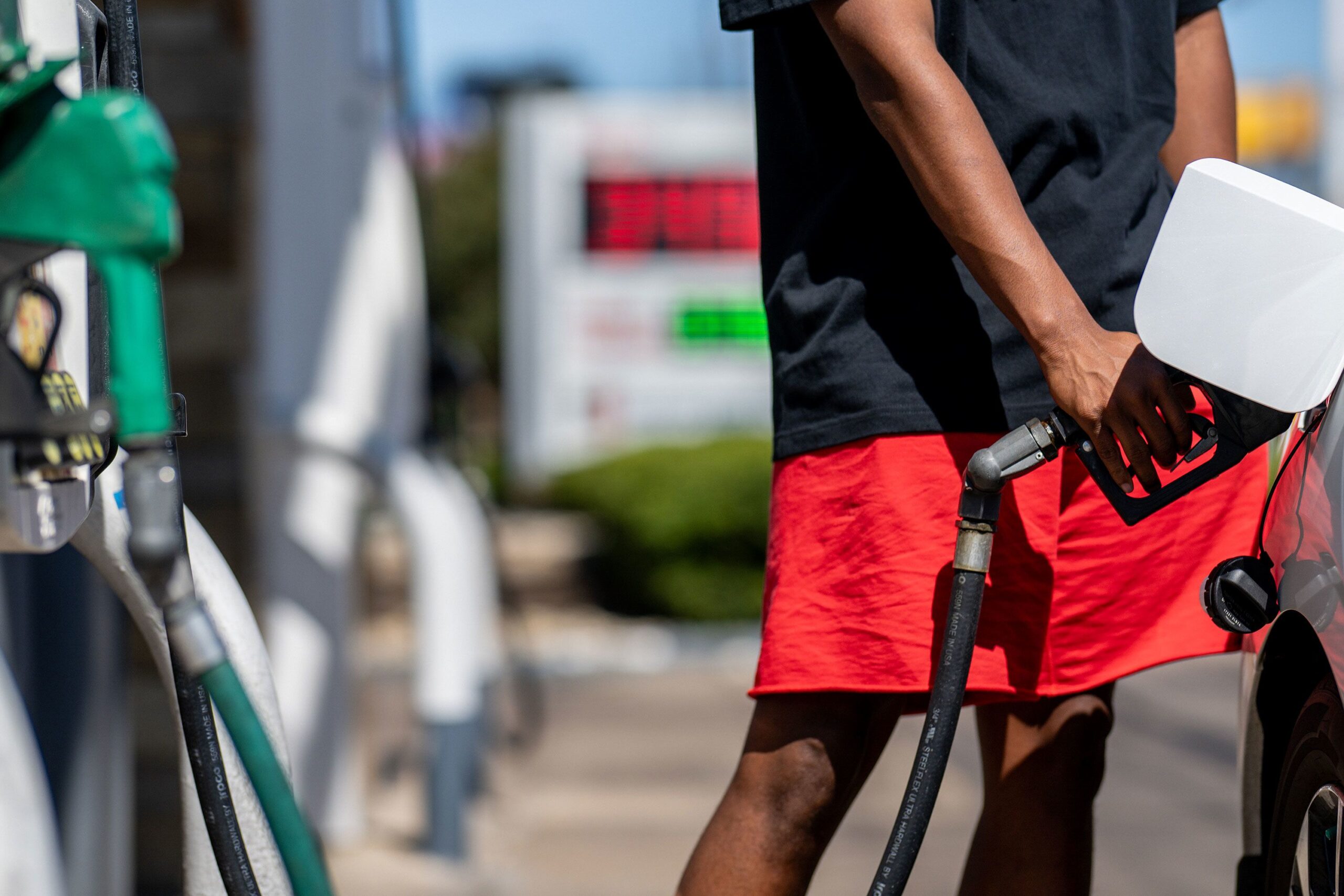 A person pumps gas at a Shell gas station on August 3 in Austin, Texas. Gas stations around the cou...