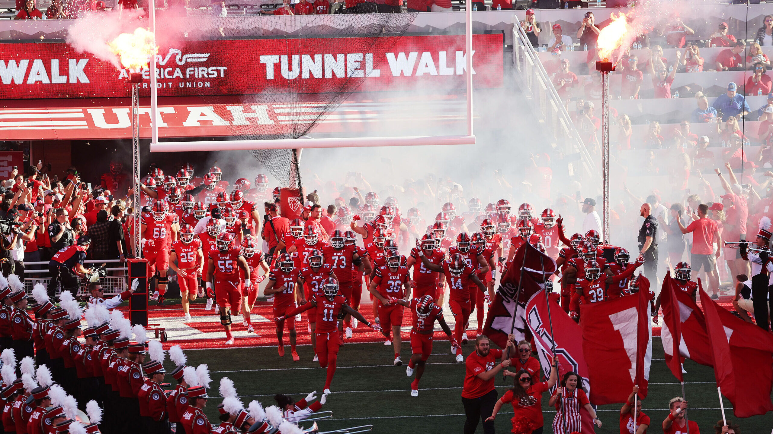 Image of the University of Utah football team as they take the field during their season opener at ...