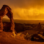 The sun sets as a rainstorm blows over Delicate Arch in Arches National Park near Moab (Spenser Heaps, Deseret News)