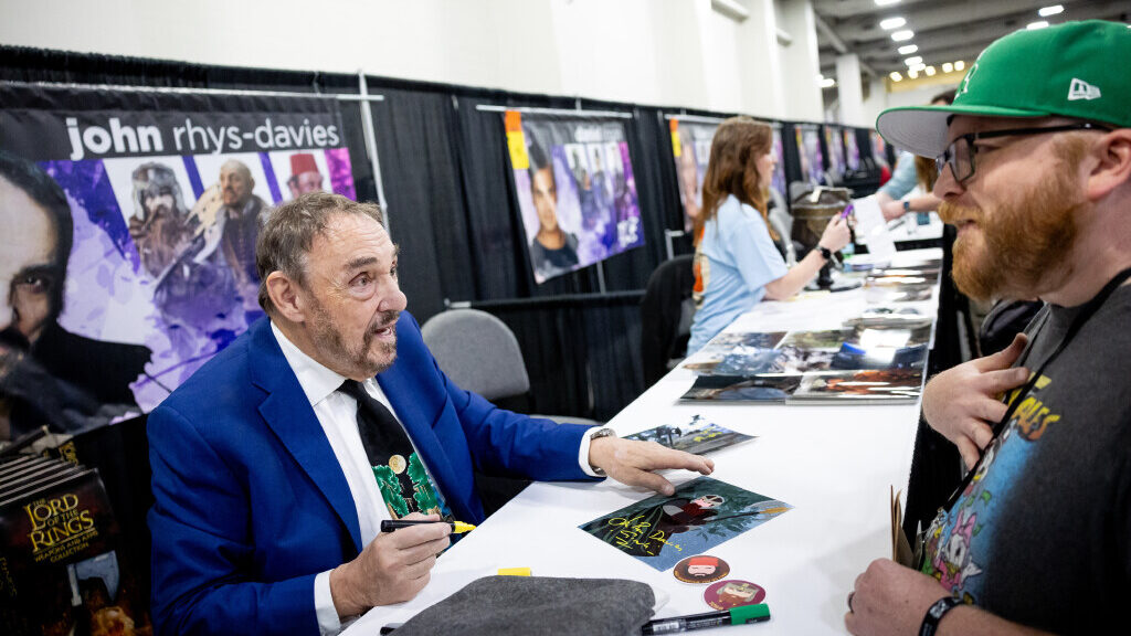 Image of actor John Rhys-Davies, known for playing Gimli in "The Lord of the Rings" trilogy, signin...
