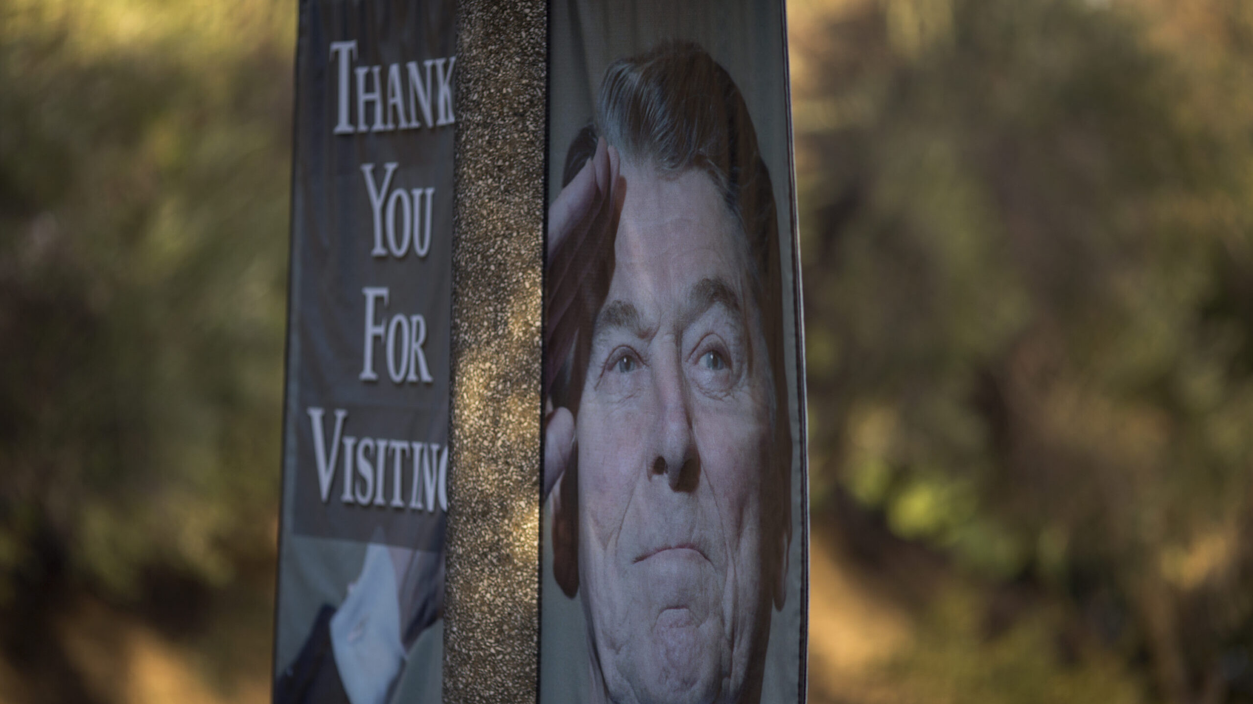 A banner bearing the image of President Reagan hangs near the Ronald Reagan Presidential Library. T...