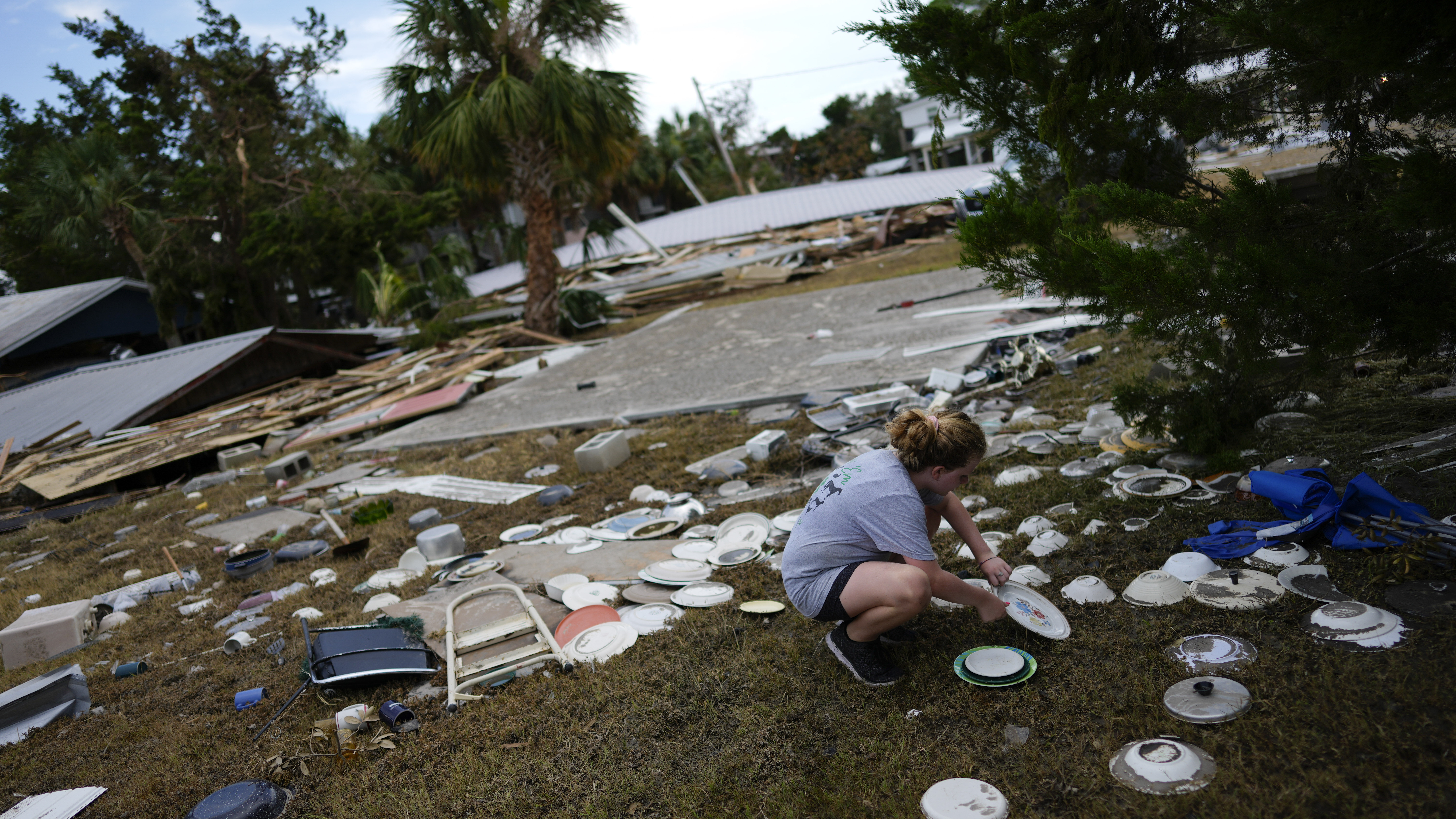 HORSESHOE BEACH, Fla. (AP) — Two people were charged with looting a home damaged by Hurricane Id...