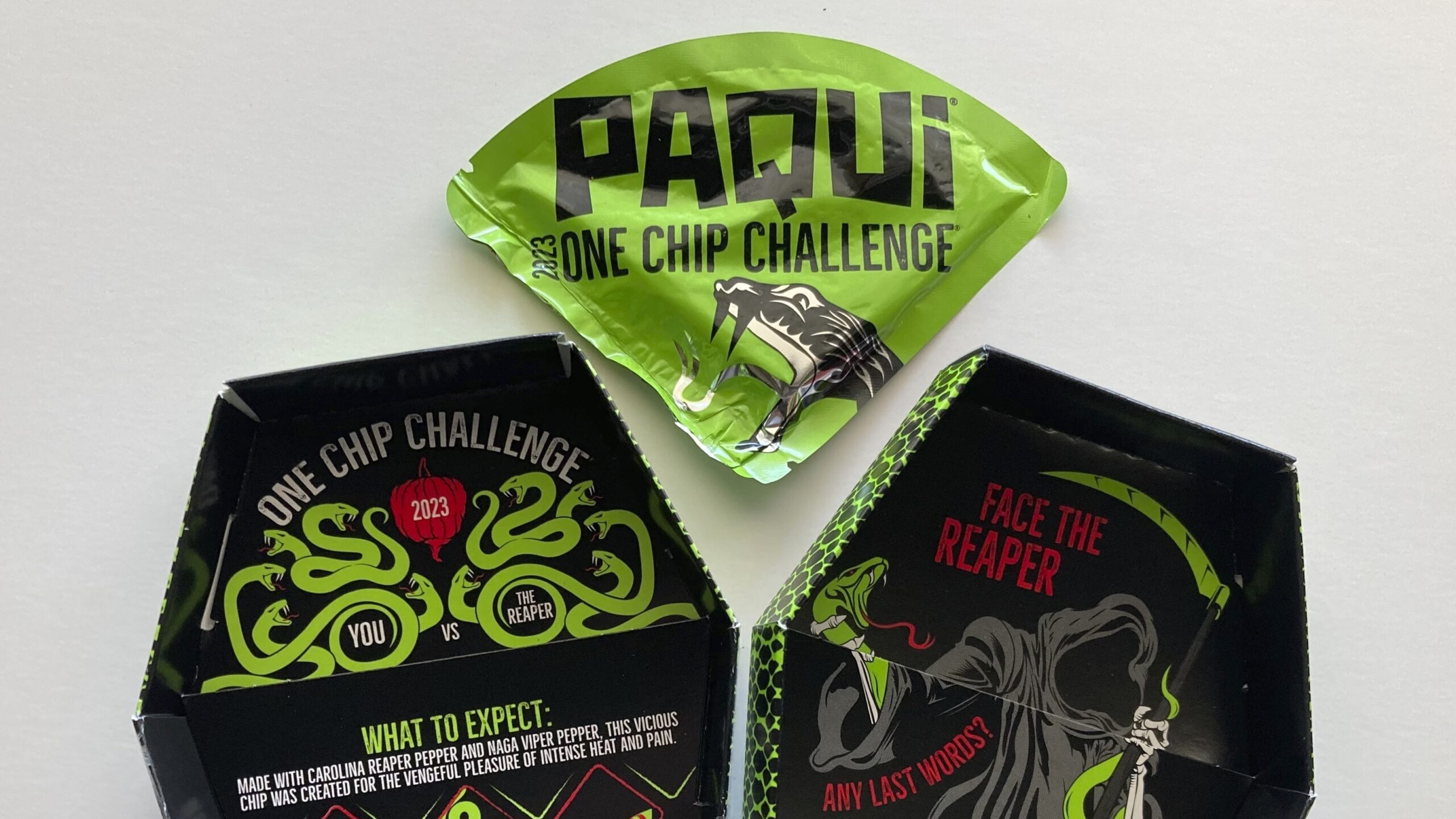 Image of a package of Paqui OneChipChallenge spicy tortilla chips, which has been pulled rom shelve...