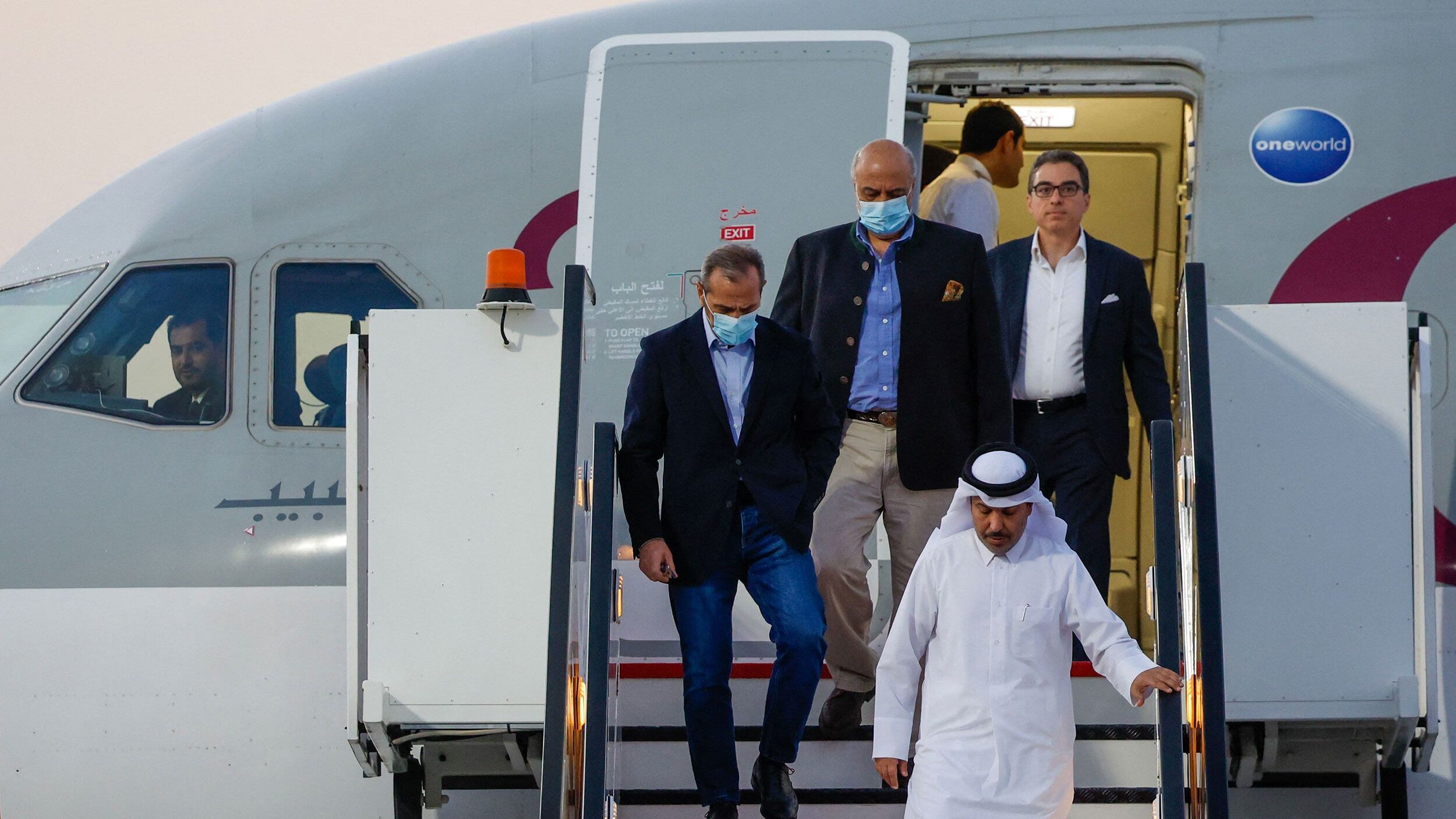 US citizens Siamak Namazi (R), Emad Sharqi (L) and Morad Tahbaz (C) disembark from a Qatari jet upo...