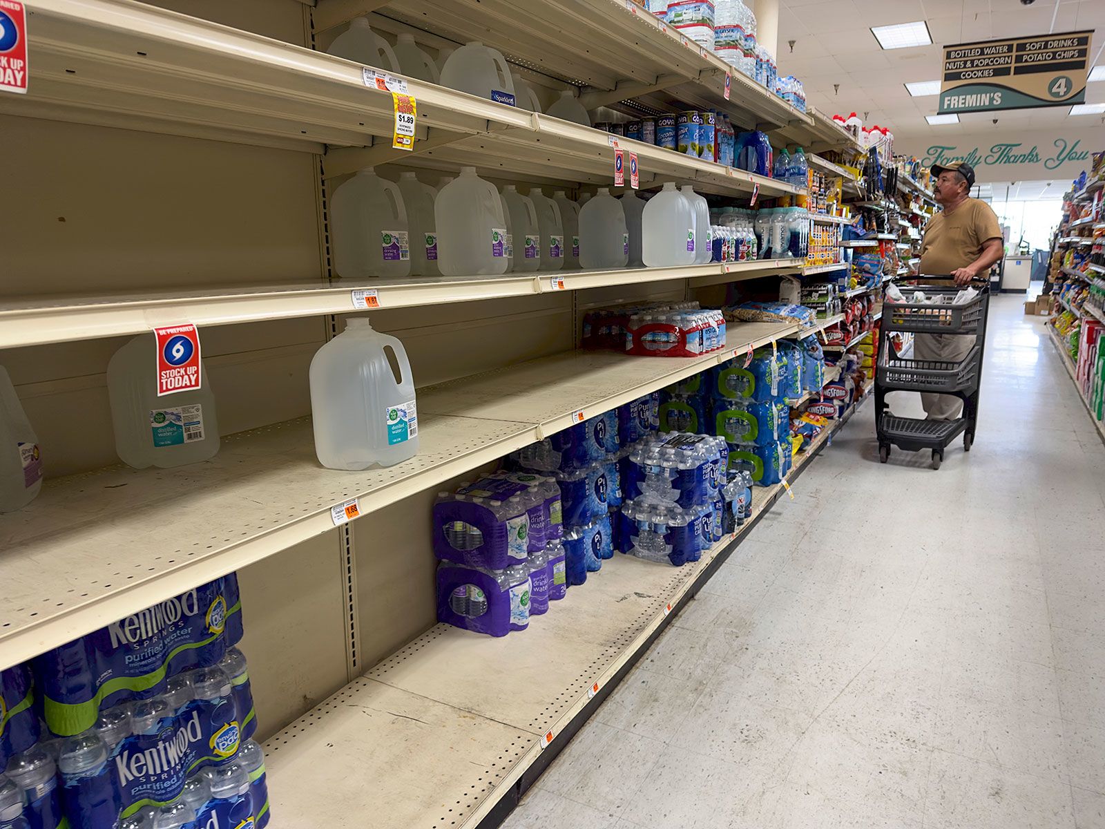 Shelves of bottled water were far from full Friday at Fremin's Food Market in Port Sulphur, Louisia...