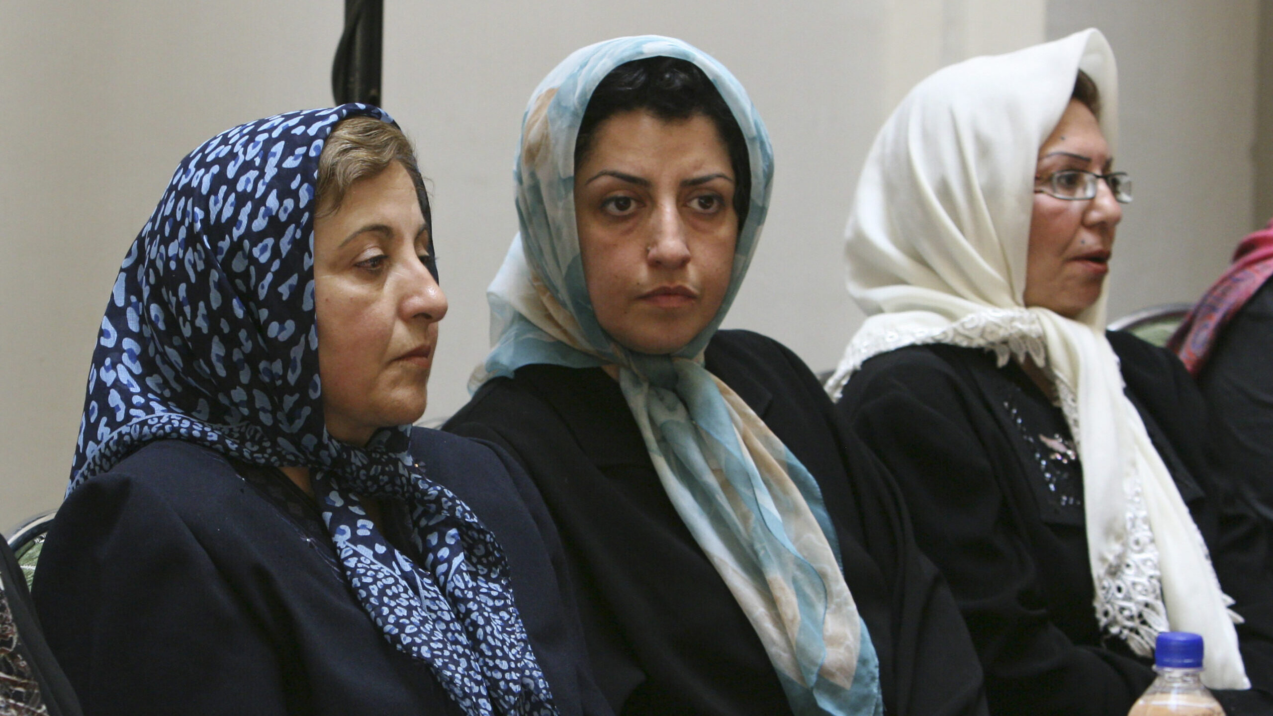 Image of Iranian human rights activist Narges Mohammadi, sitting next to Iranian Nobel Peace Prize ...