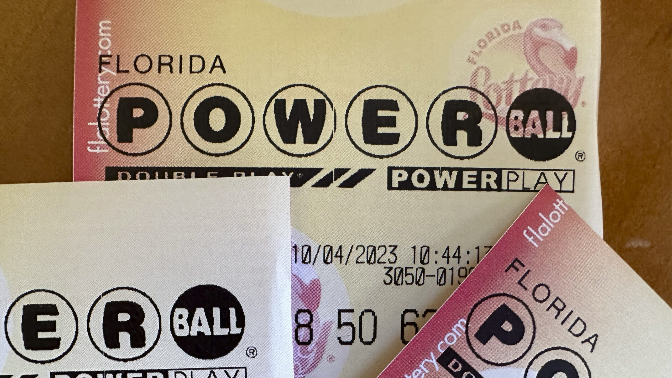 Powerball lottery tickets are displayed Oct. 4, 2023, in Surfside, Fla. An estimated $1.4 billion P...