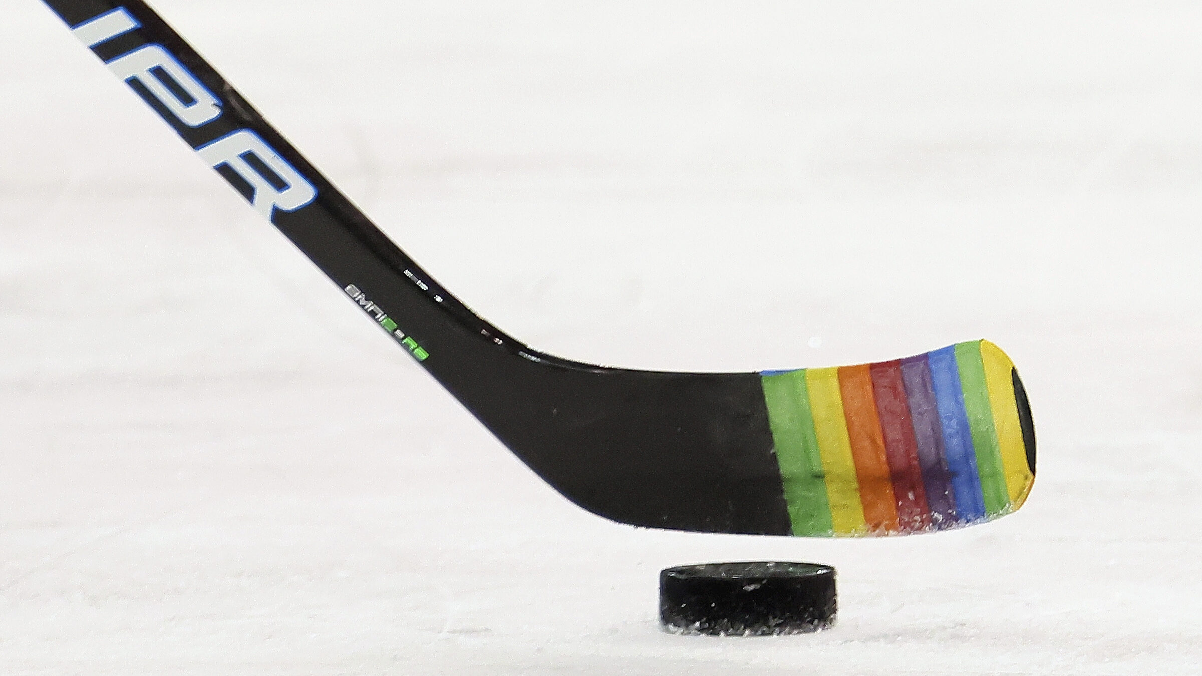 FILE - Zac Jones of the New York Rangers skates with a stick decorated for "Pride Night" in warm-up...