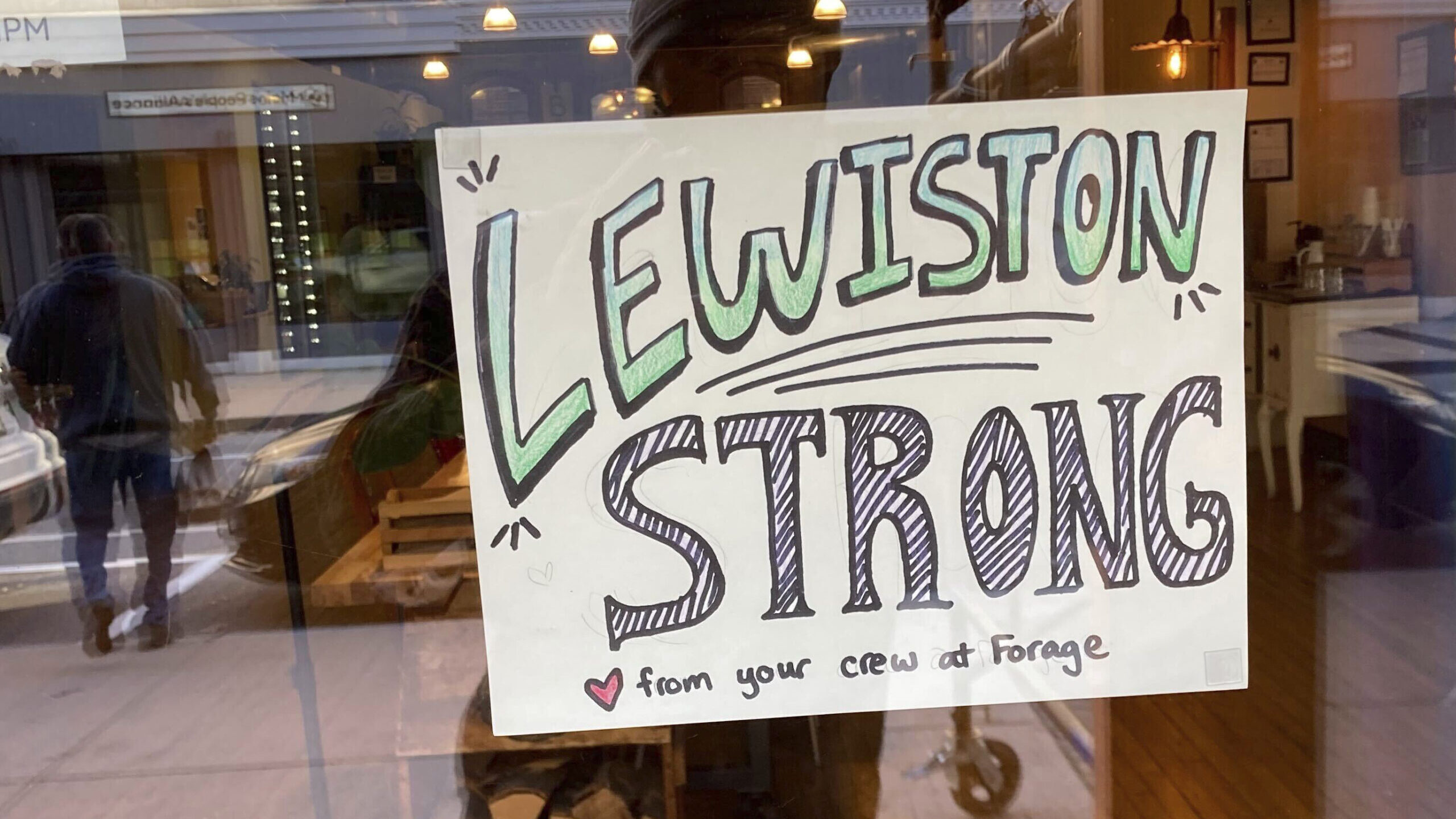lewiston strong sign hung up in window...