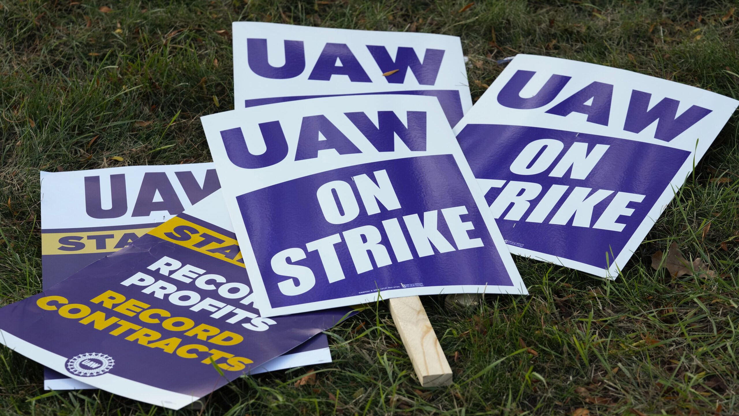 FILE - United Auto Workers signs for a strike are shown at the Stellantis Sterling Heights Assembly...