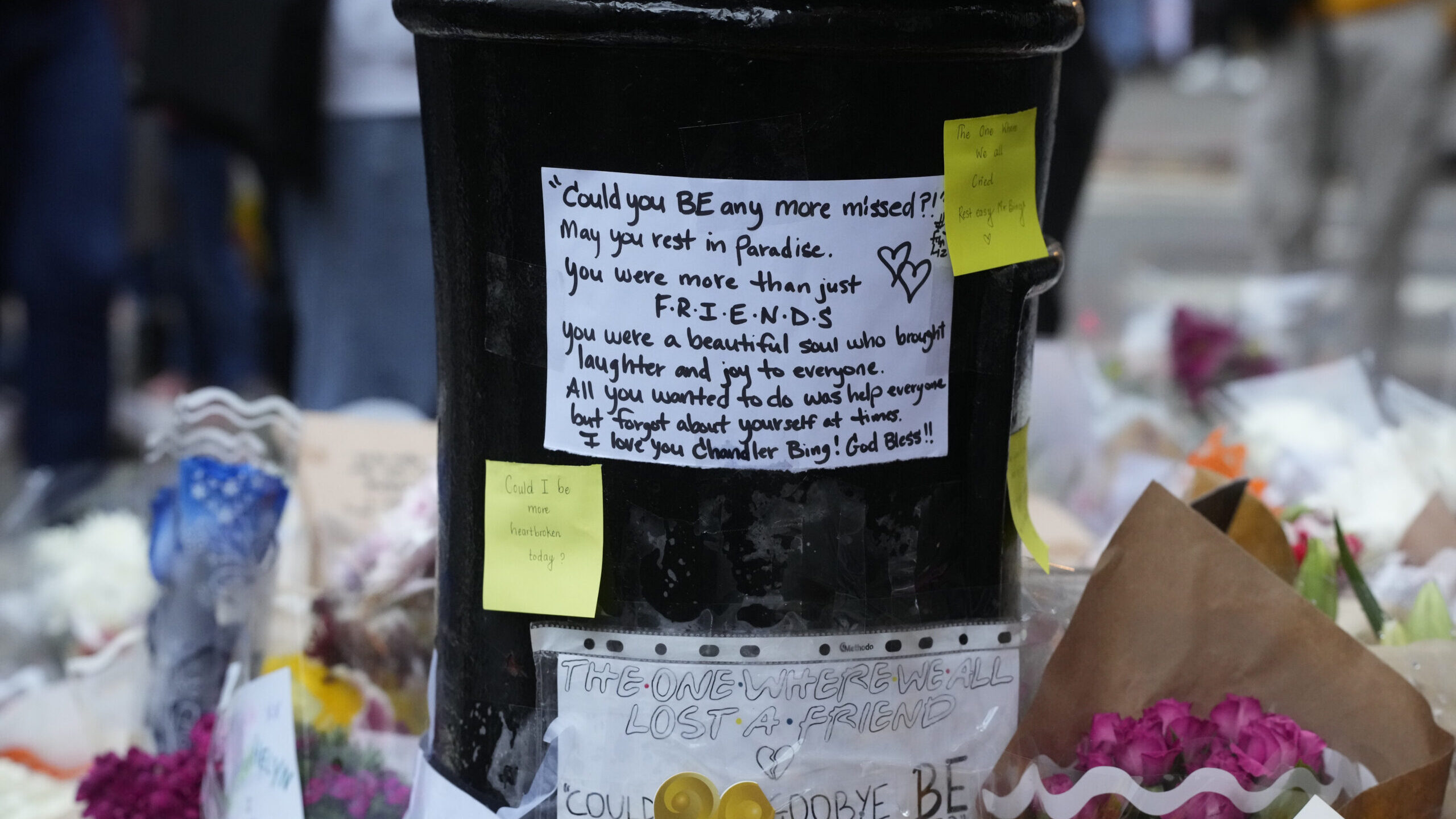 A makeshift memorial for Matthew Perry is seen outside the building shown in exterior shots of the ...