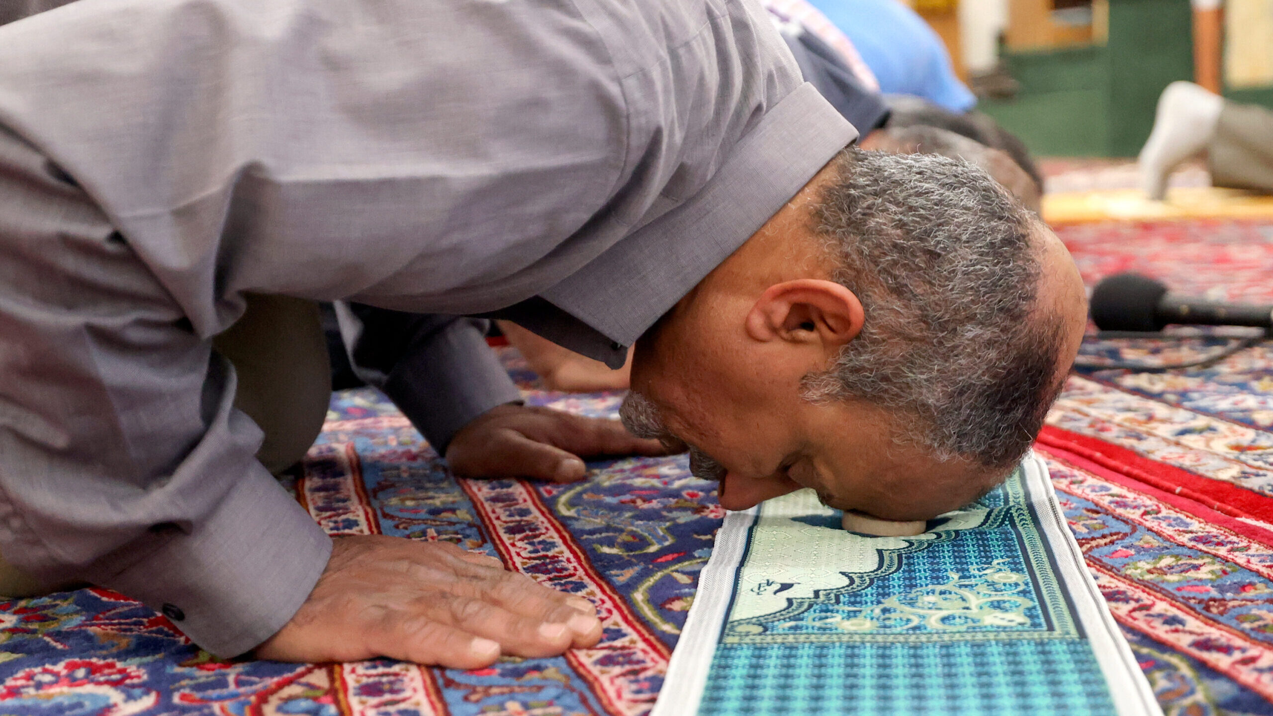 a man prays at the Alrasool Islamic Center of Utah...