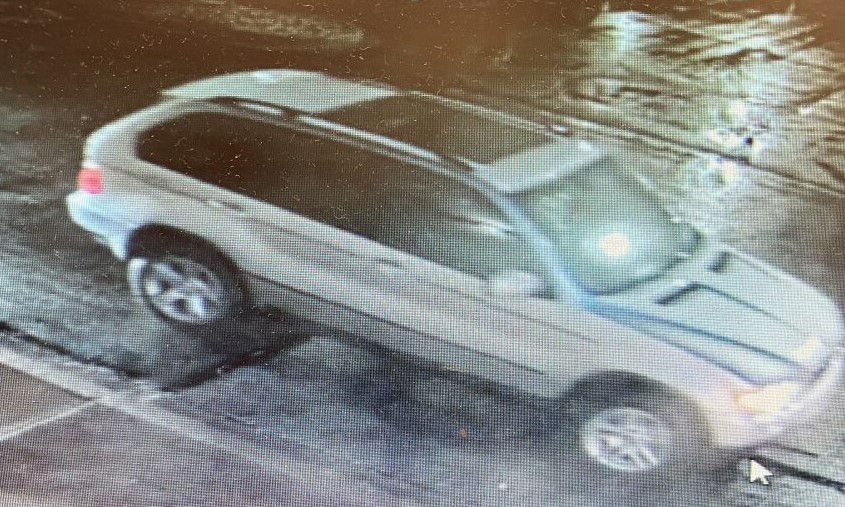 An image of the light colored SUV...