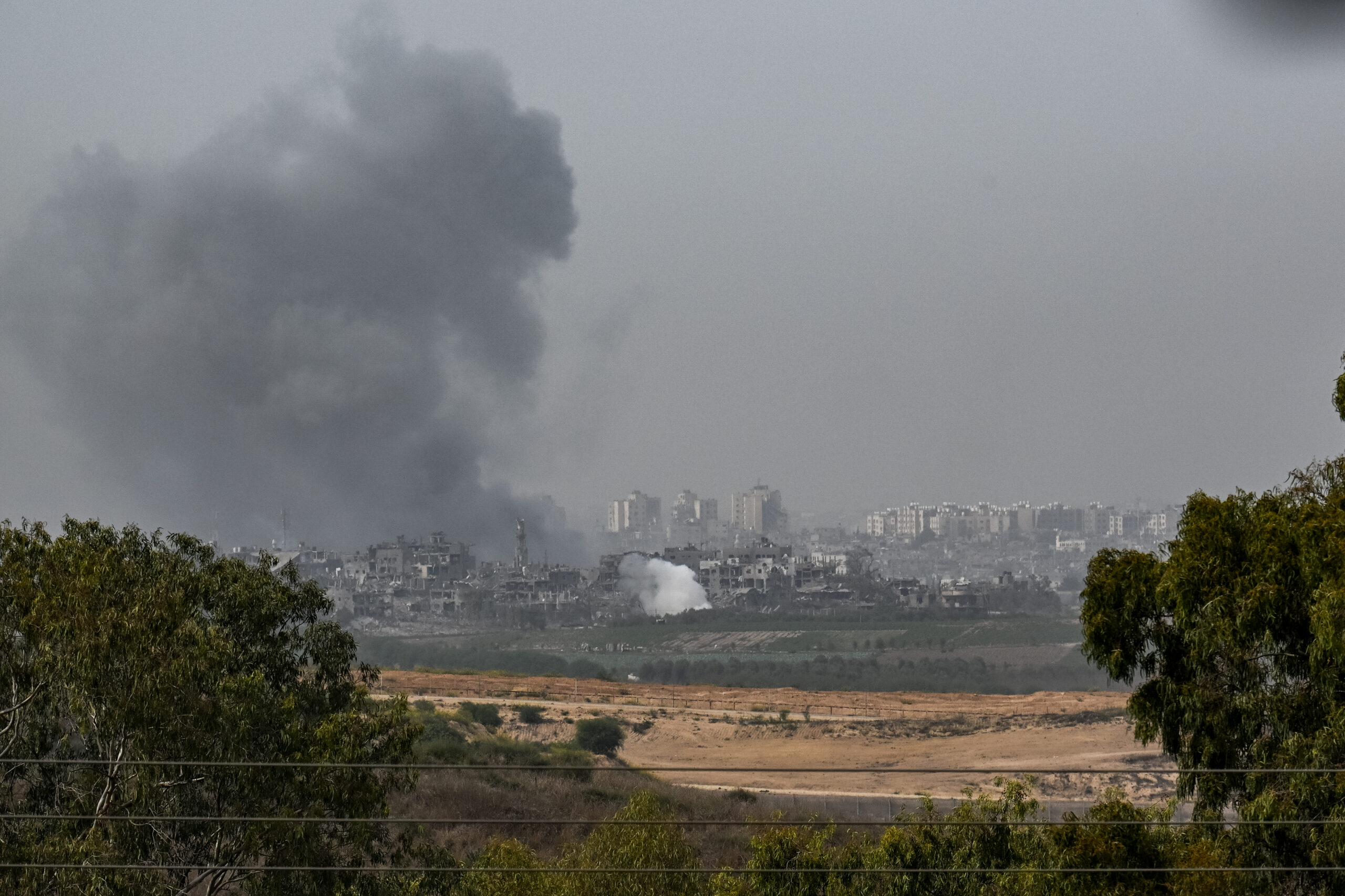 An incoming Israeli military strike on buildings in Gaza City, as seen from the border area on Octo...