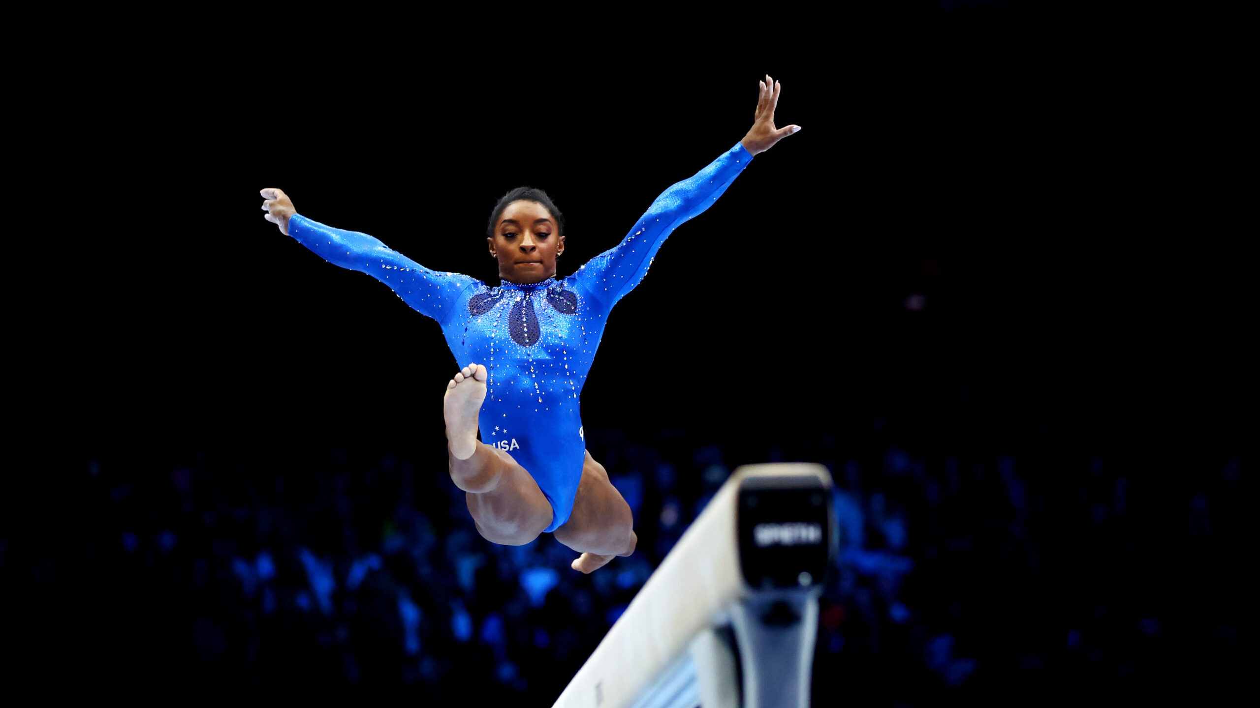 Simone Biles competes on the balance beam. Biles won her 6th all-around title at worlds....