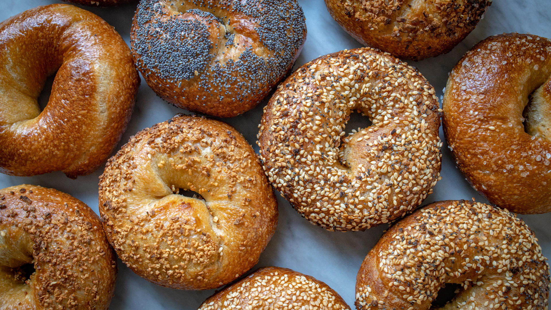 Different kinds of bagels are shown. BOUNTIFUL, Utah -- A bagel shop in Bountiful is getting attent...