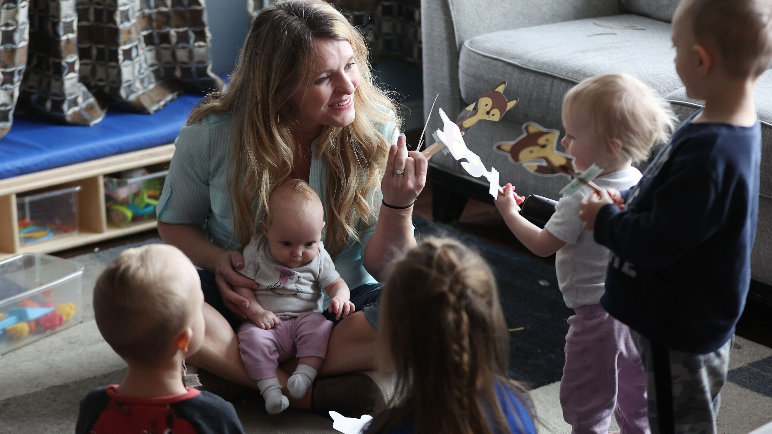 Child care provider Holly Kingston teaches children at her home in West Jordan. Child care needs ar...
