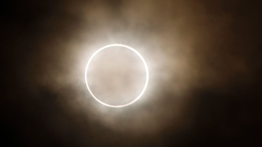 Image of an annular eclipse, when the moon crosses between Earth and the sun A signature "ring of f...