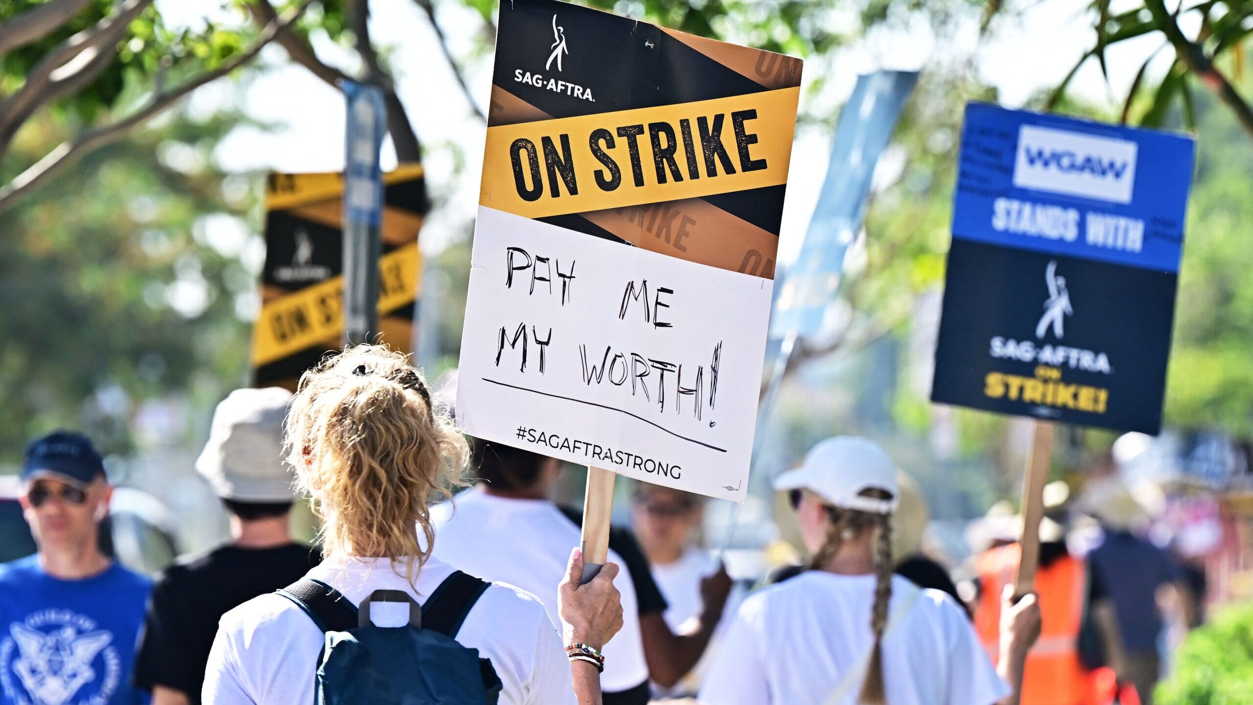 SAG-AFTRA members picket outside of Netflix's building on day 99 of their strike against the Hollyw...