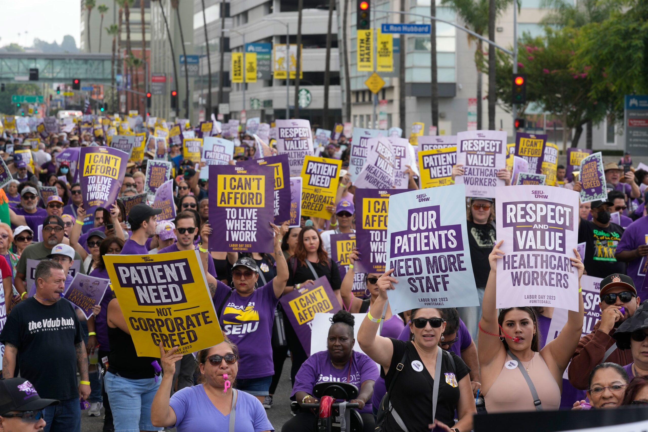Frontline healthcare workers hold a demonstration on Labor Day outside Kaiser Permanente Los Angele...