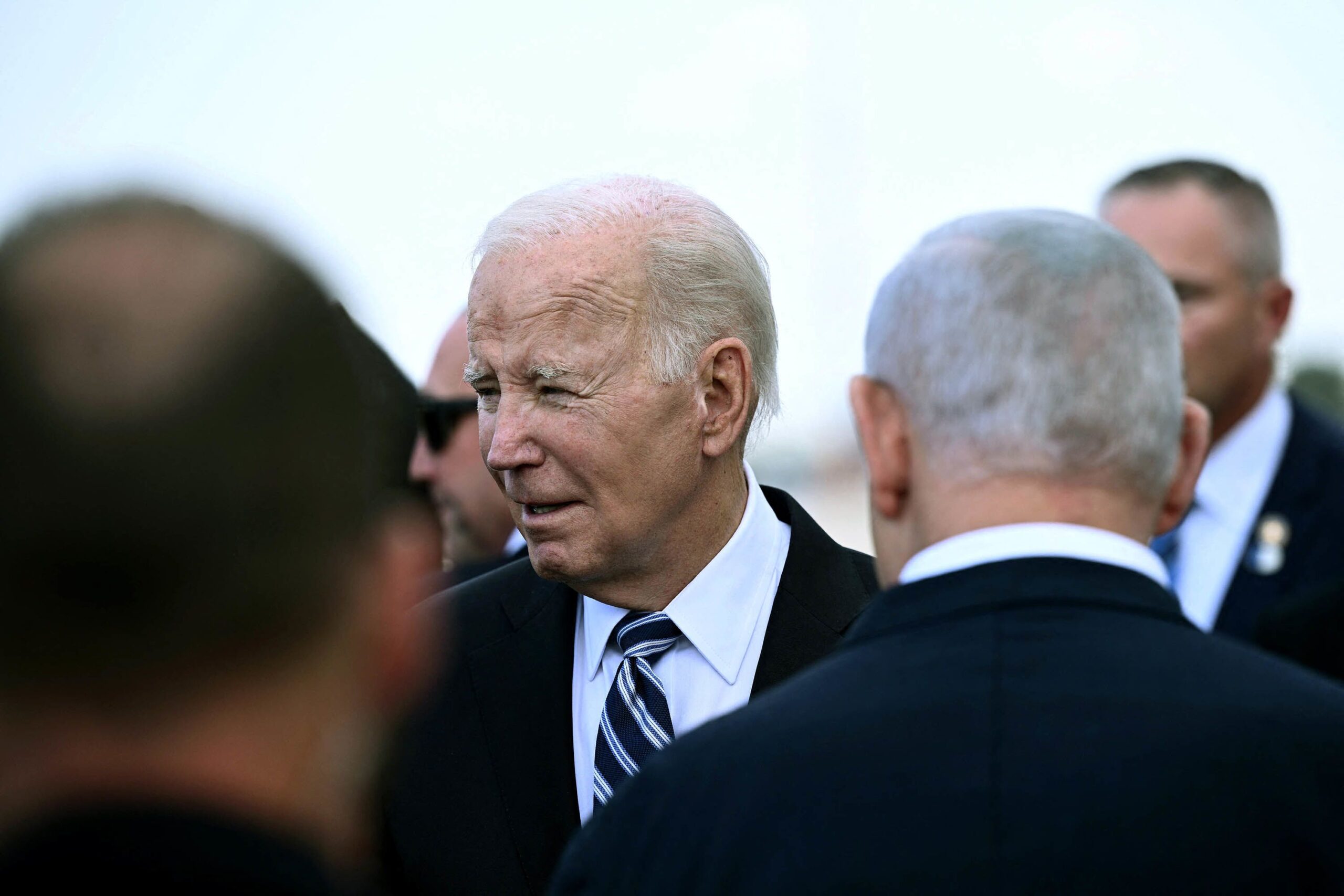 Israel Prime Minister Benjamin Netanyahu (back L) greets President Joe Biden upon his arrival at Te...