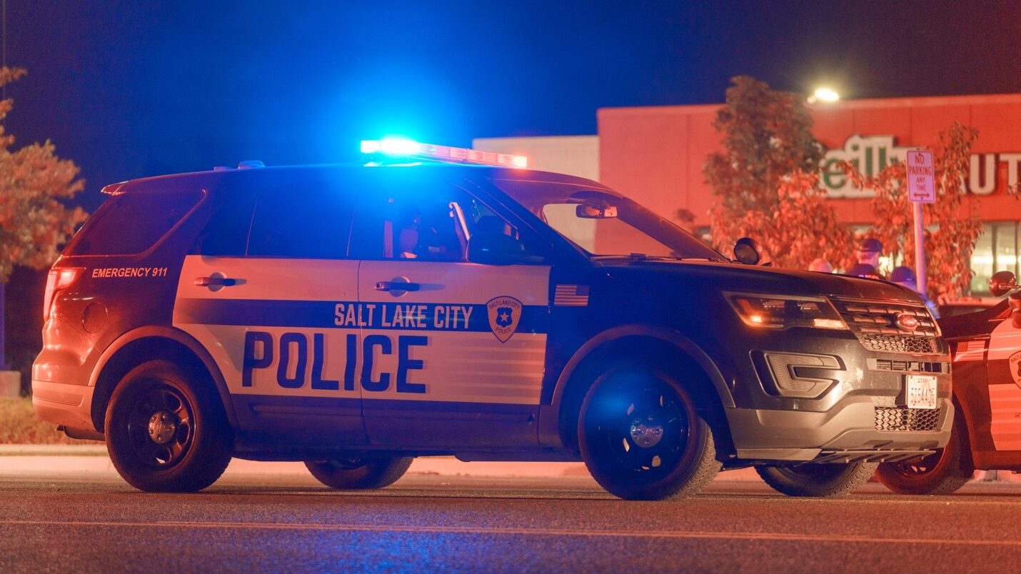 A Salt Lake City police car blocks traffic on Redwood Road near 1130 South after a deadly crash (Oc...