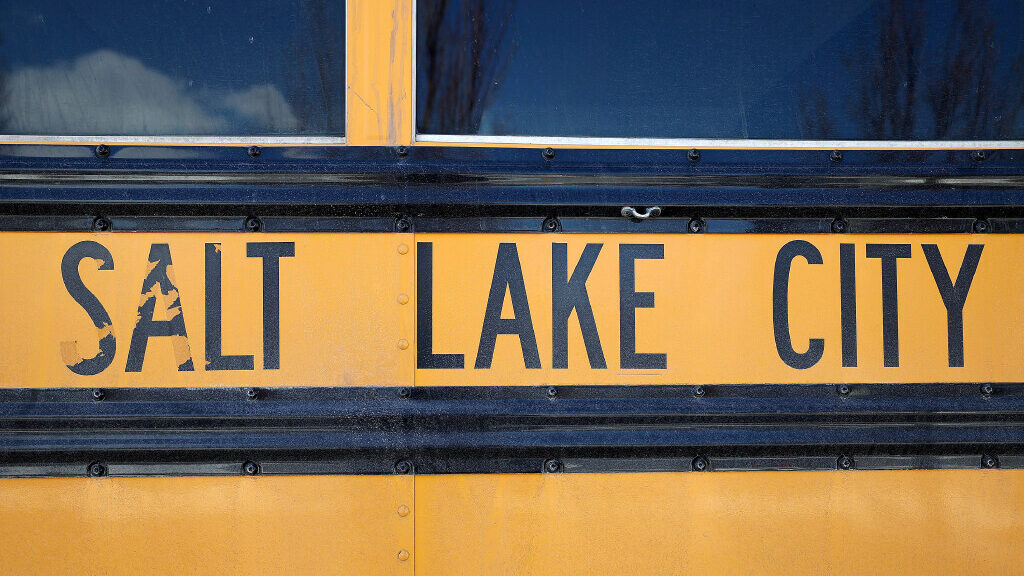 A Salt Lake City School District bus is pictured outside of the Capitol in Salt Lake City, on Tuesd...