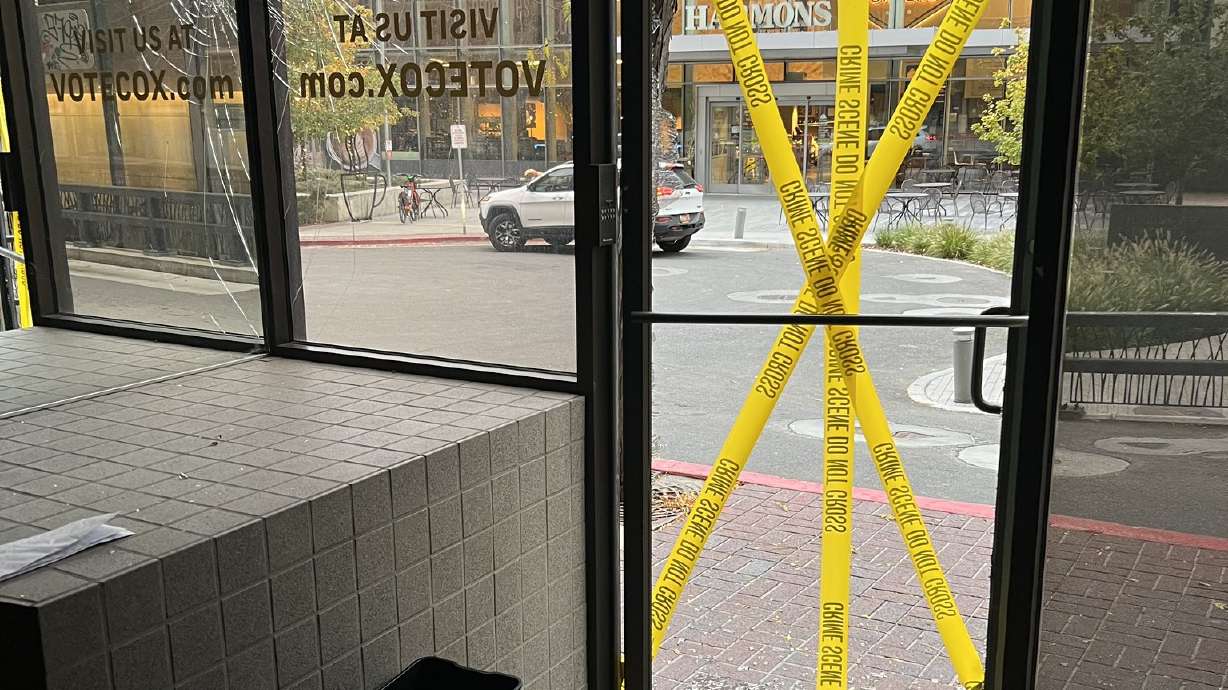 Police tape is seen Nov. 6 after Gov. Spencer Cox's campaign headquarters in Salt Lake City was van...