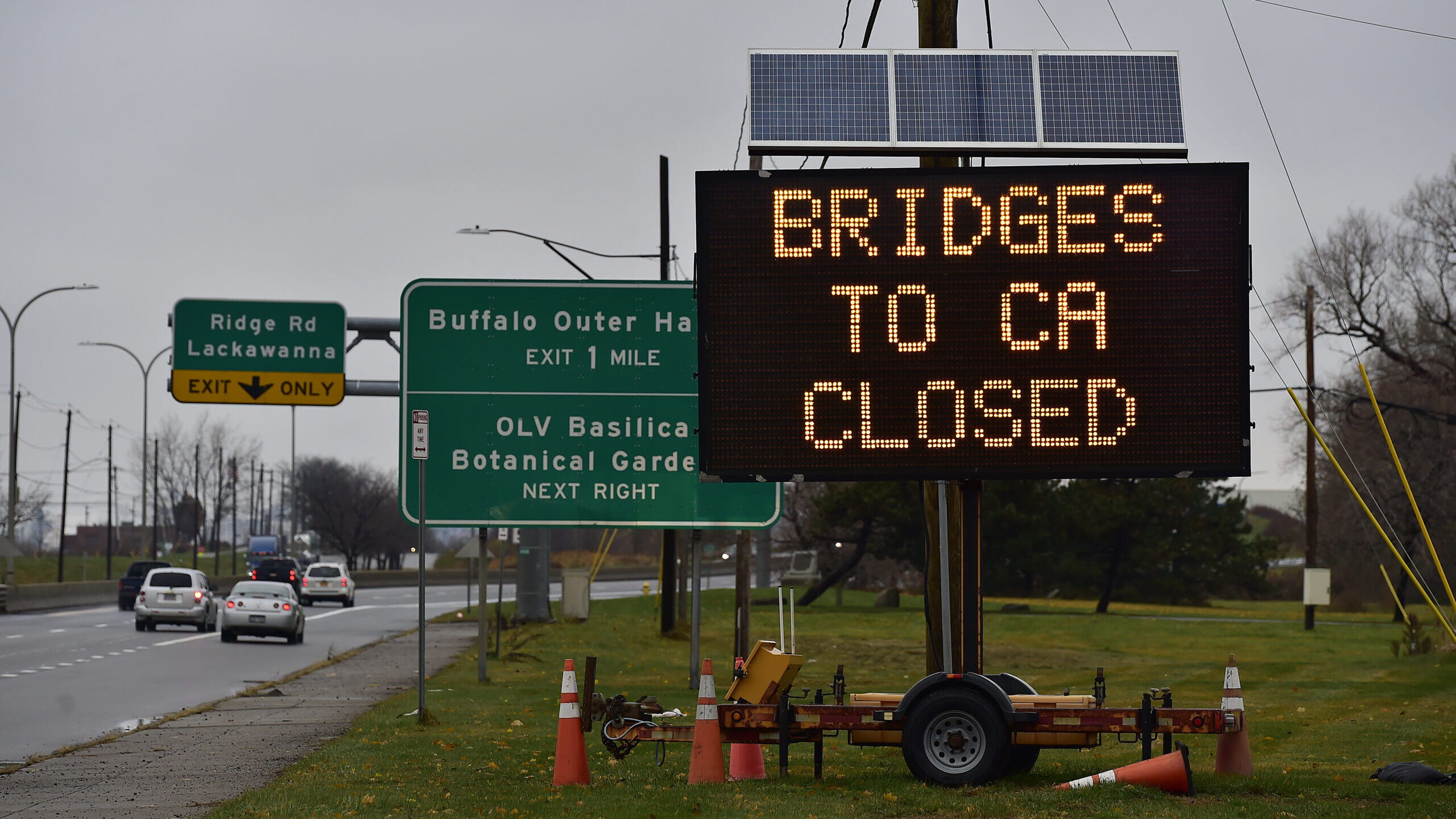 A sign indicates that all bridges between the U.S. and Canada are closed after a car crashed and ex...