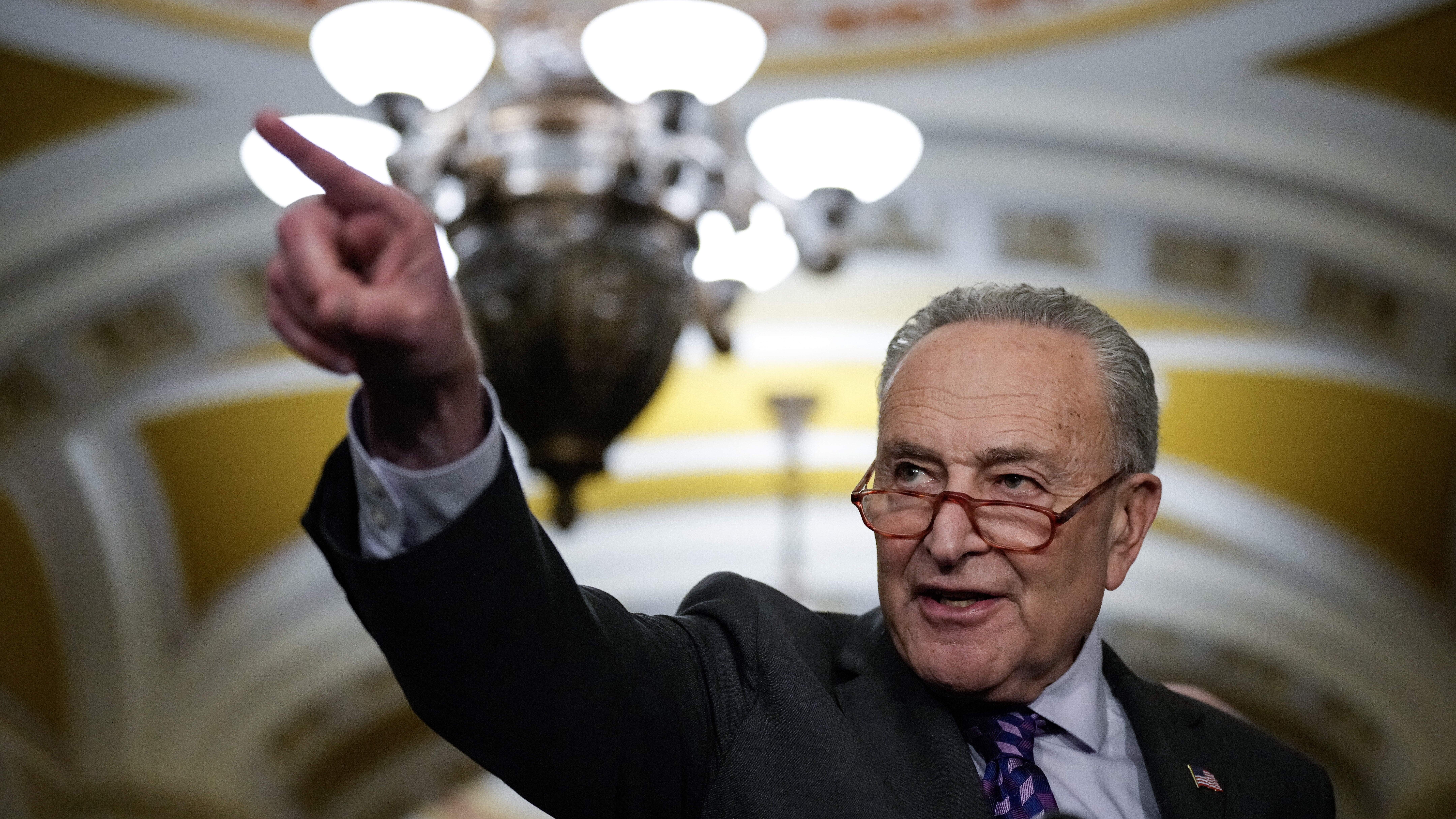 Senate Majority Leader Chuck Schumer (D-NY) speaks during a news conference following a closed-door...