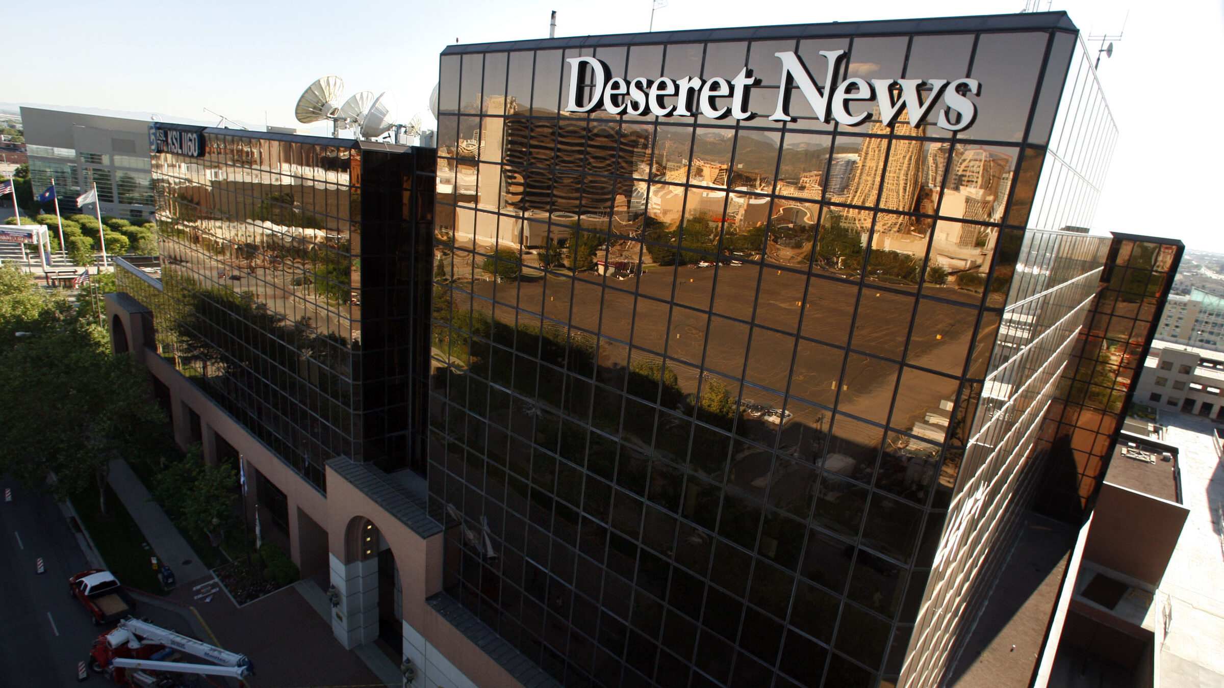 Young Electric Sign company workers install the new Deseret News sign Saturday, July 2, 2011 on the...