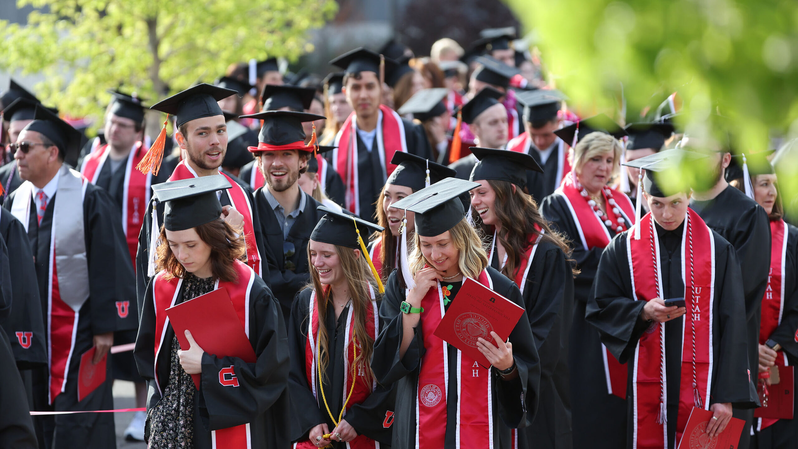 Students walk during the the University of Utah's commencement in Salt Lake City. Women across the ...