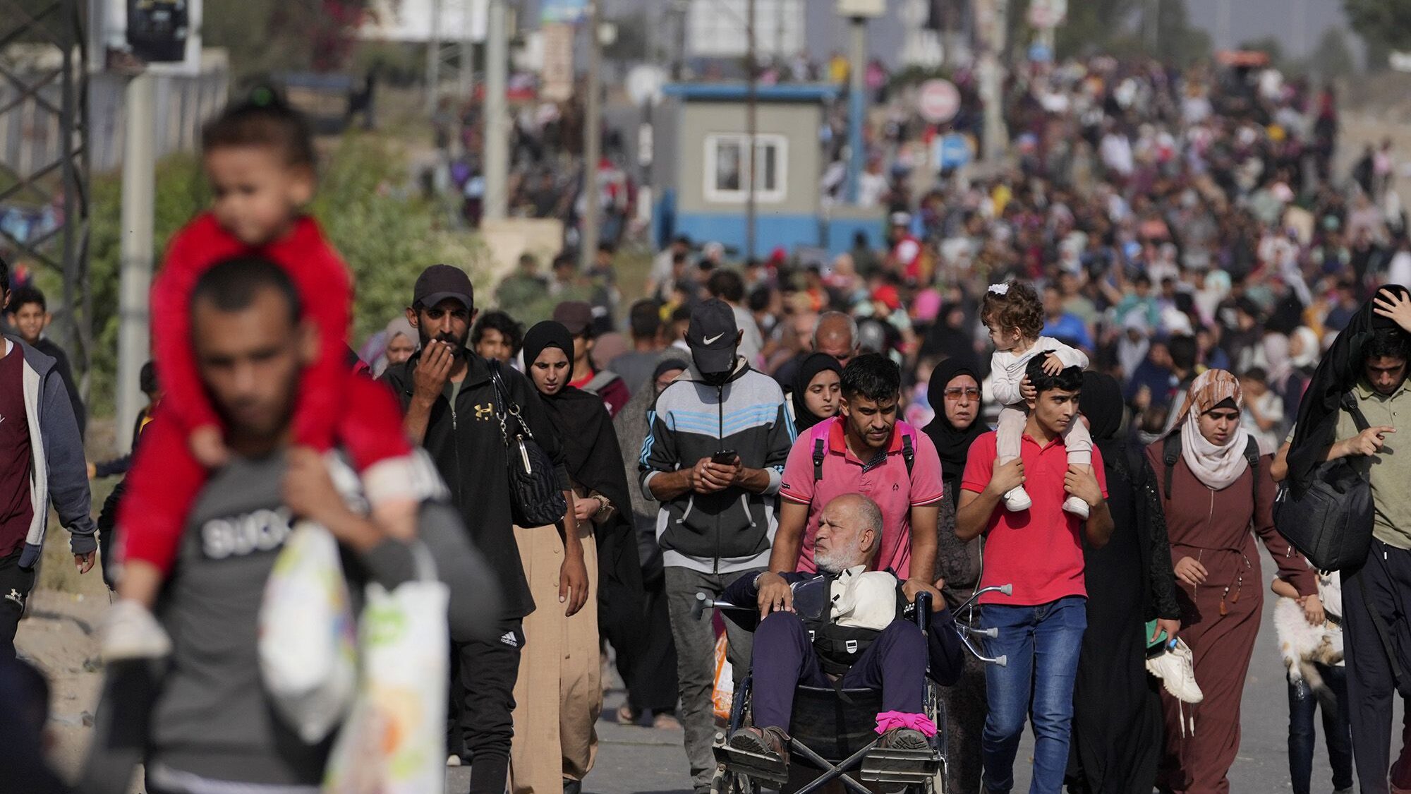 Palestinians flee to the southern Gaza Strip via Salah al-Din Street on Wednesday....