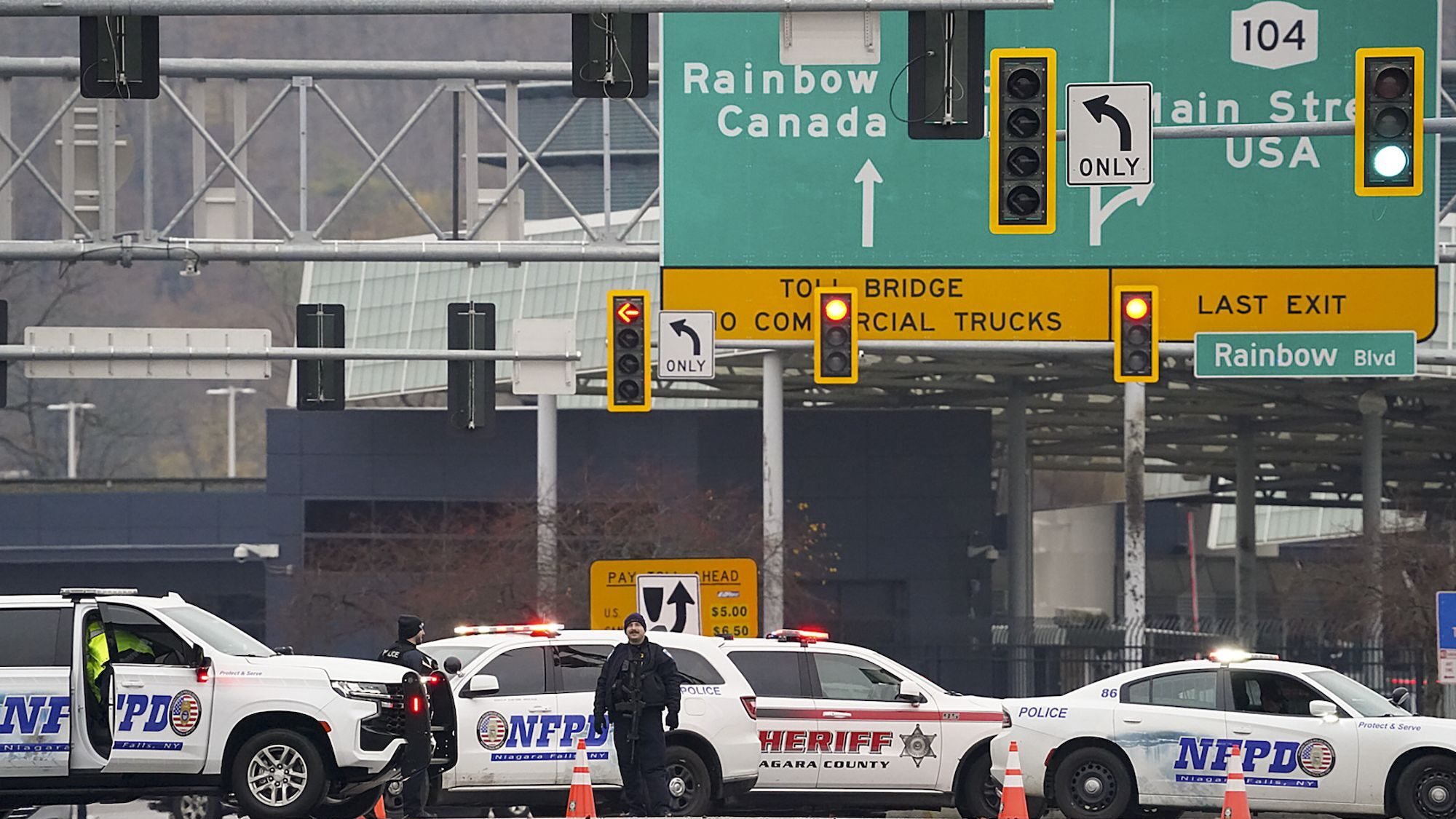 Law enforcement personnel block off the entrance to the Rainbow Bridge, Wednesday, November 22, in ...