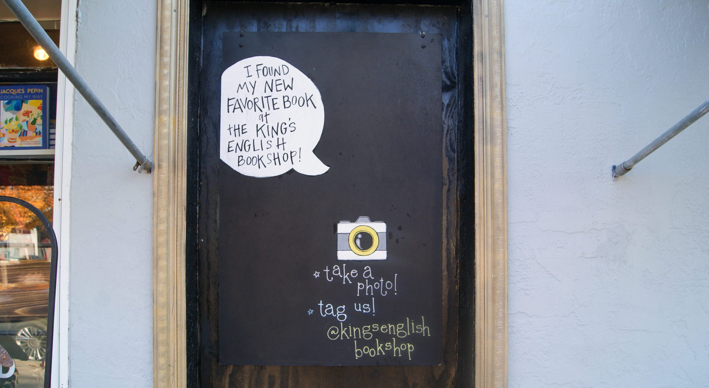 A mural on the outer wall of The King's English Bookshop in Salt Lake City. A speech bubble reads "...