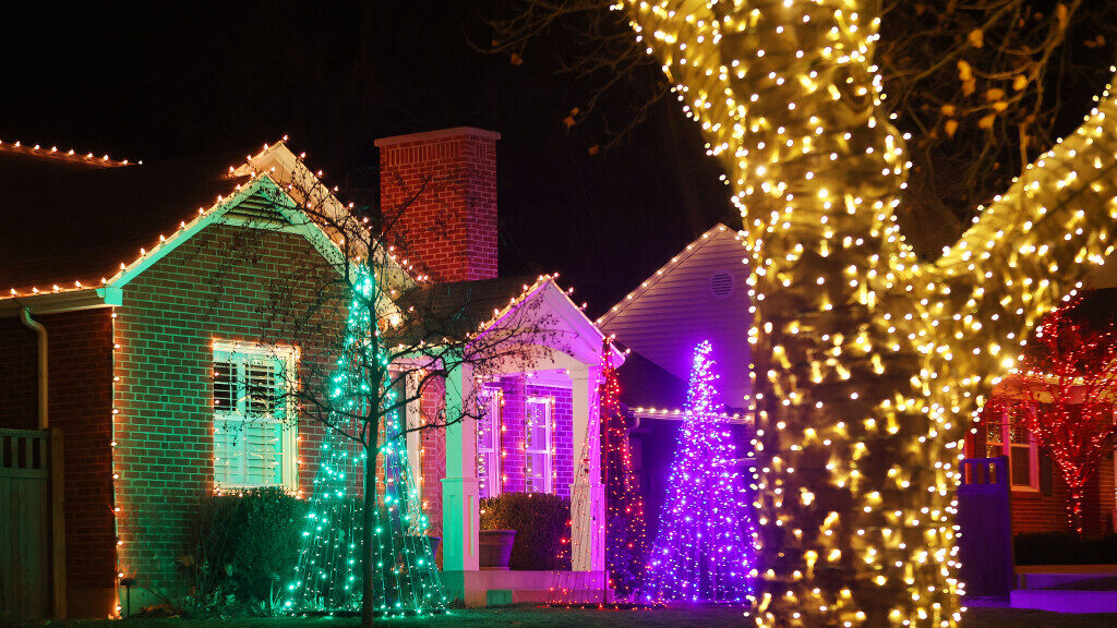Homes and trees are lit up during the Night for a Cause in Salt Lake City on Thursday, Dec. 21, 202...