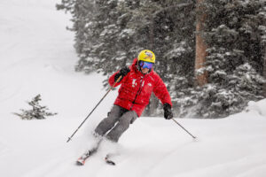 Junior Bounous, 98, finds a bit of fresh powder on off the edge of a groomed run while skiing at Snowbird on Thursday, Dec. 7, 2023.