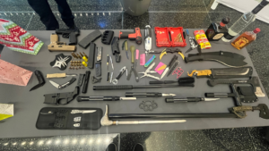 A table filled with prohibited items. Officials said agents routinely find prohibited items in people's carry-ons. (Adam Small/KSL NewsRadio)